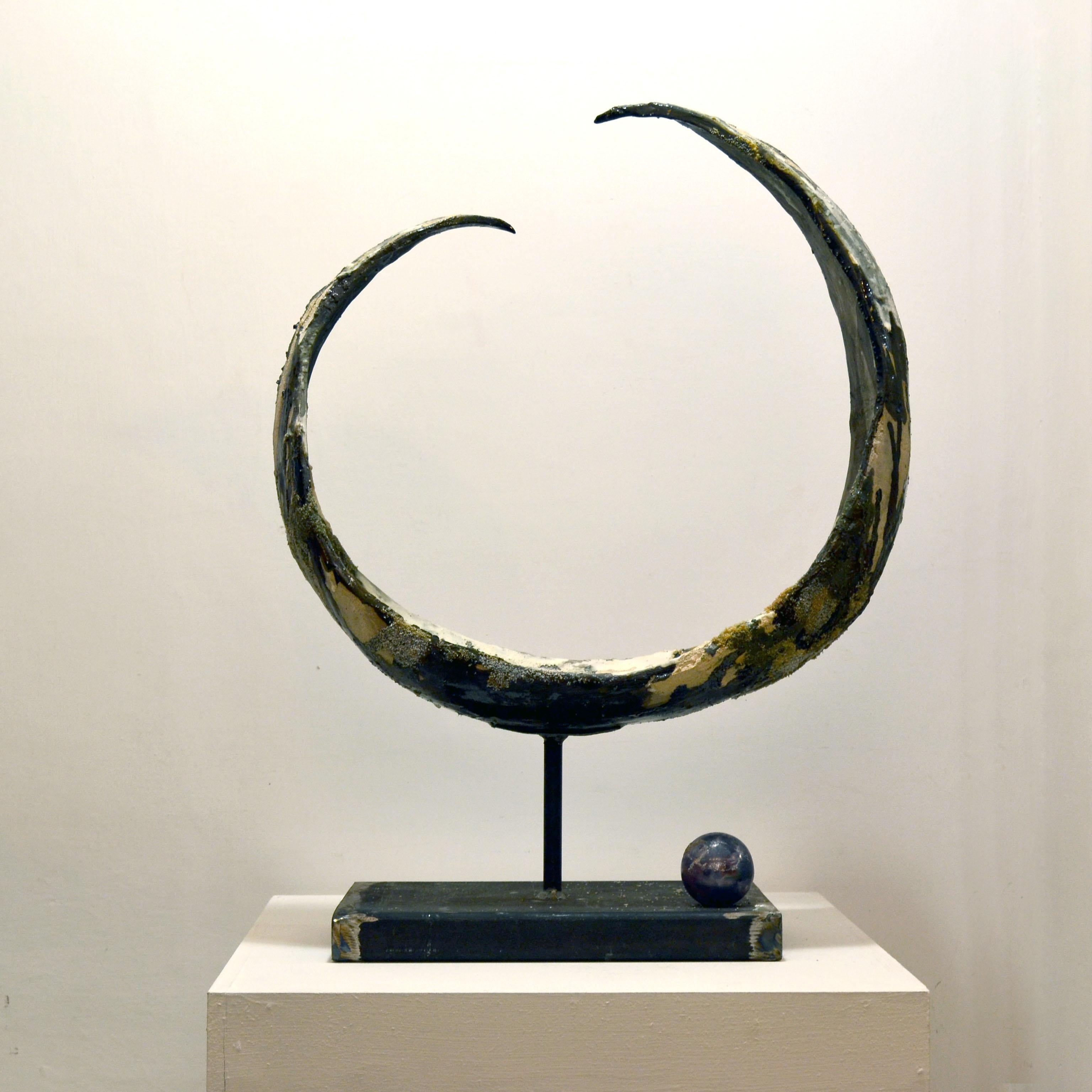 Hand-formed clay sculpture, worked with engobbio and acid in 1st firing and aventurine glaze in 2nd firing, with silica applications.
Iron base. 3rd fire sphere decoration with blue luster.
> First Prize Winner at the 8th Mino da Fiesole Prize