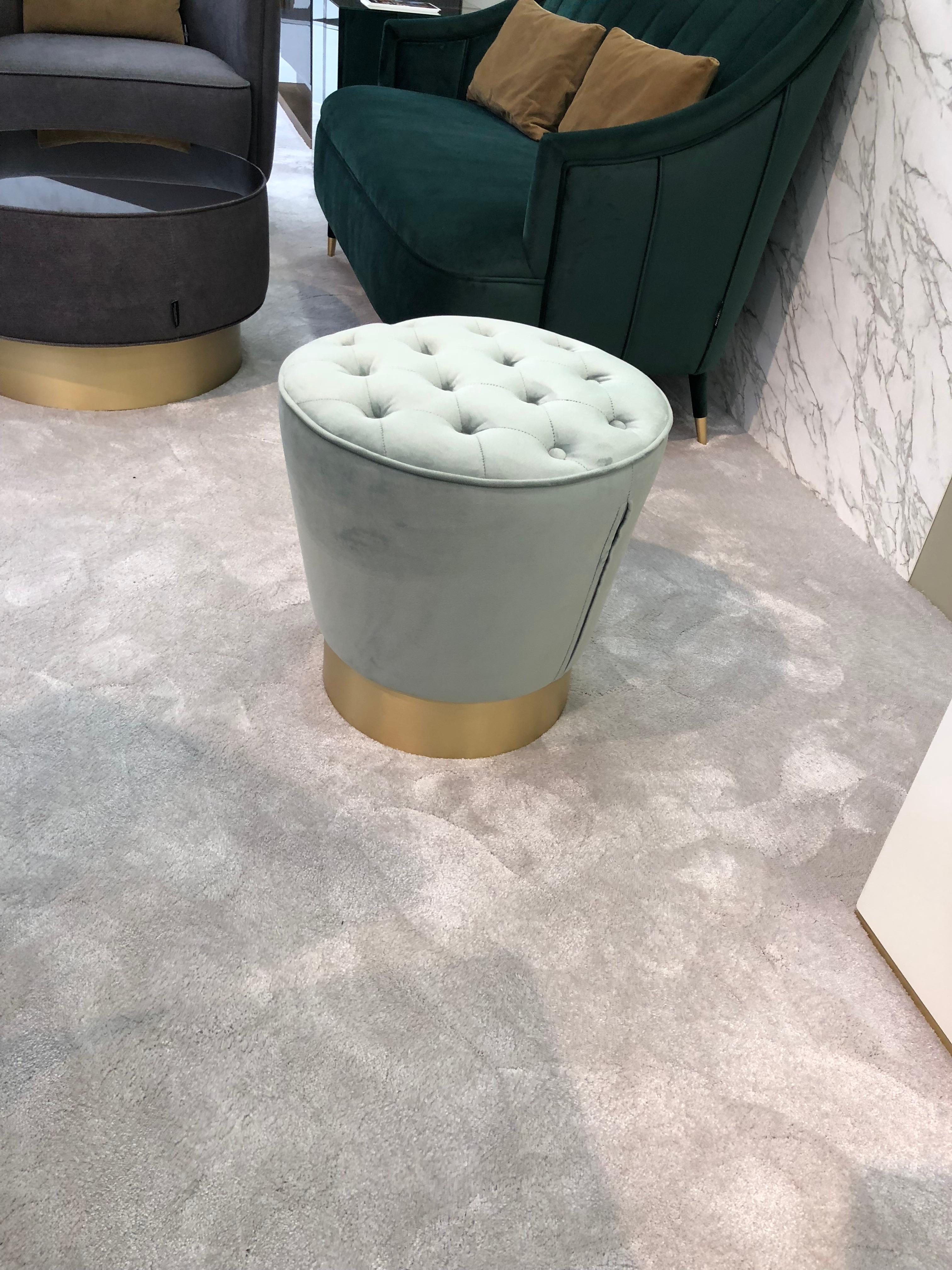 An elegant piece, with a base in brushed brass and a beautiful detailed top.

Upholstered with green nature 2767 combined with brushed brass base.
