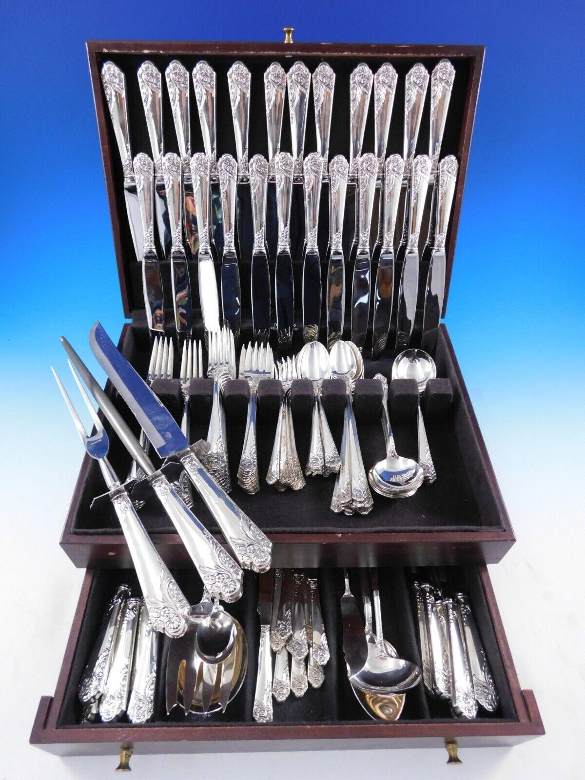 Monumental Dinner and luncheon size Ecstasy by Amston c1951 Sterling silver Flatware set with a sweeping floral design, 142 pieces. This set includes:

12 Dinner Size Knives, 9 5/8