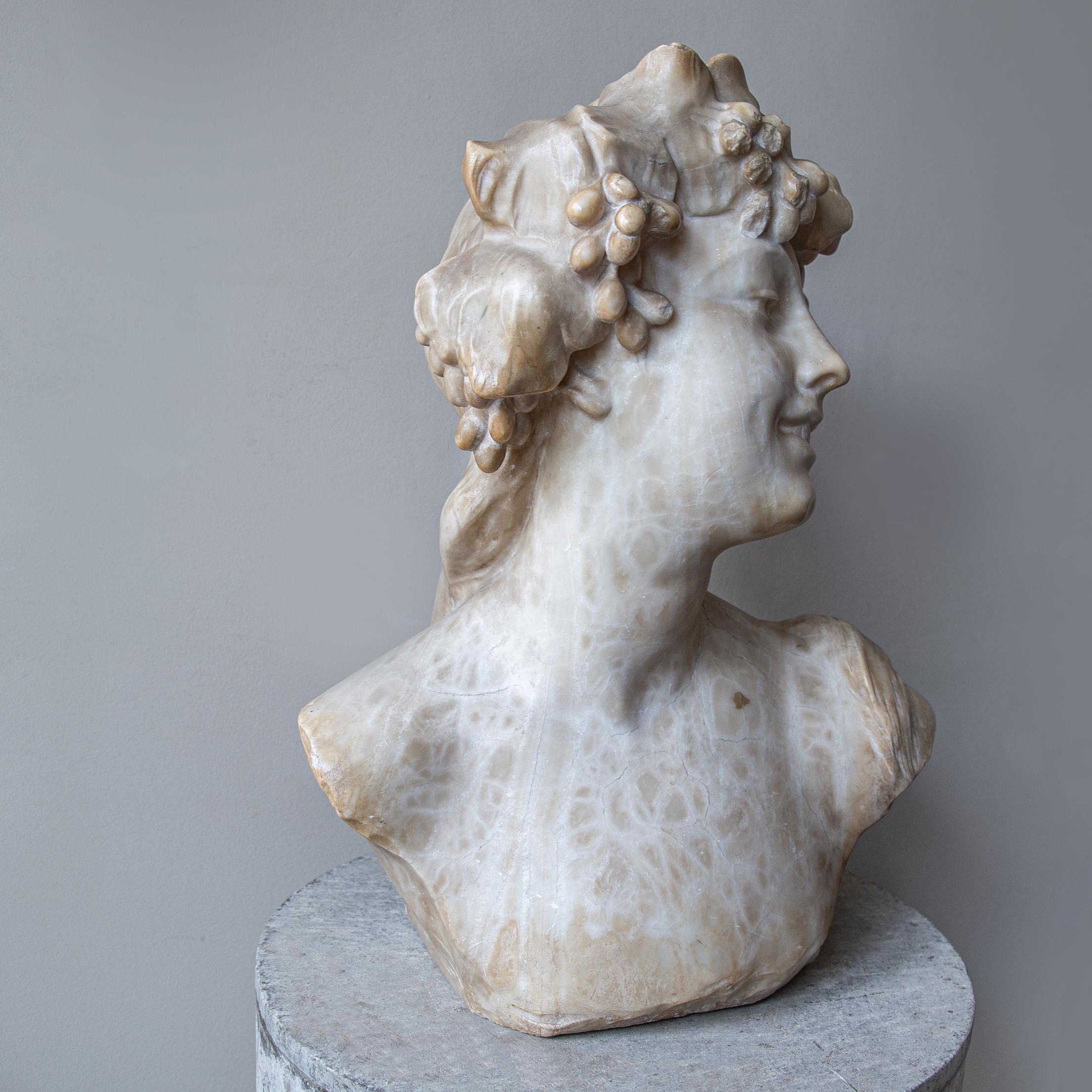A stunning, sensual and timeless bust of a reveller of Dionysus. Of good scale proportion, beautifully hand carved out of alabaster and now showing an incredible aged patination. 

Jef Lambeaux (1852-1908) was a leading Belgian figurative sculptor