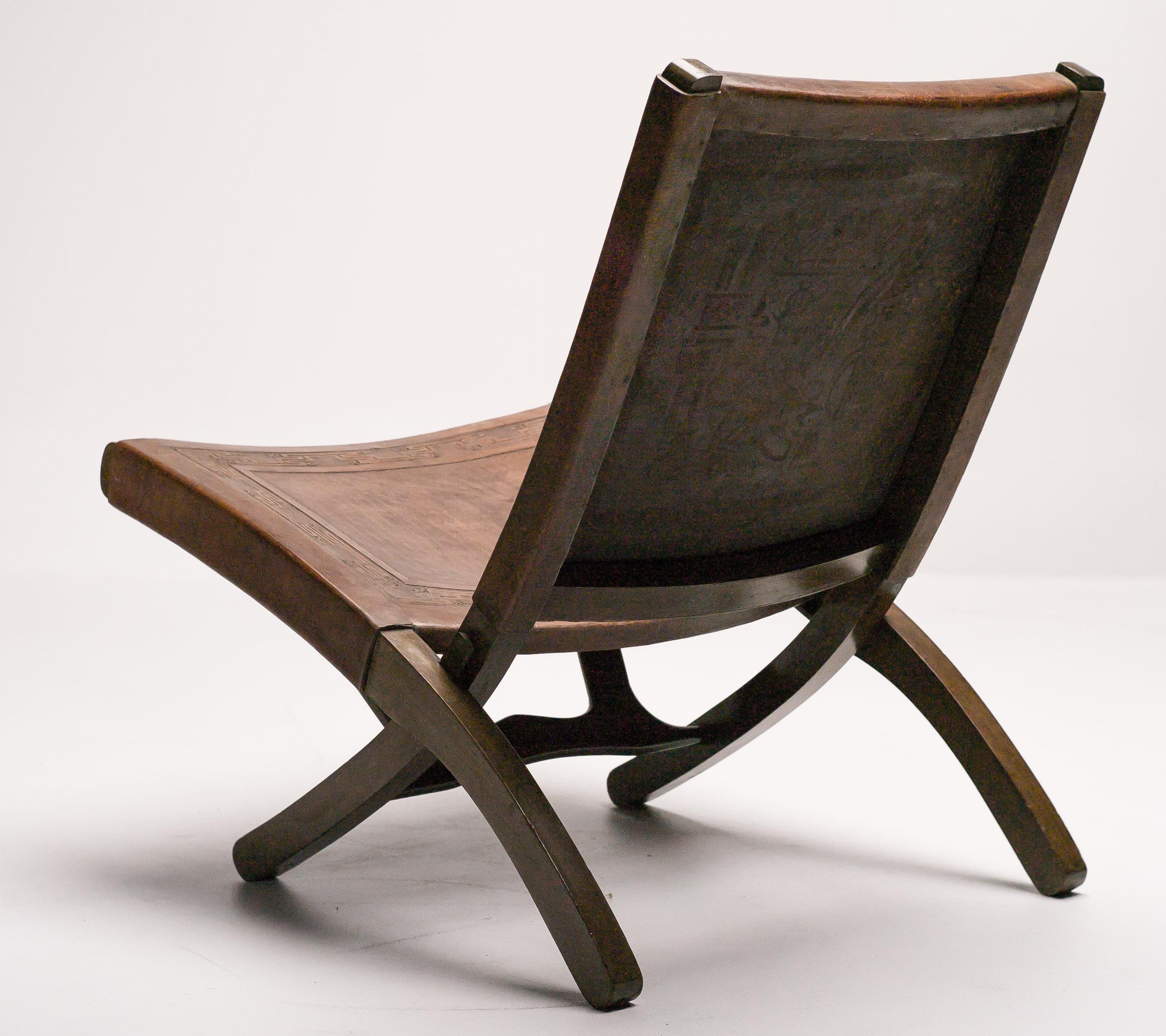 Beautiful folding chair in solid meranti, backrest and seat in brown saddle leather embossed with inca patterns.
This modernist chair was designed by Angel Pazmino for Meubles de Estilo in the late 1960s. Ecuador at this time received US aid to