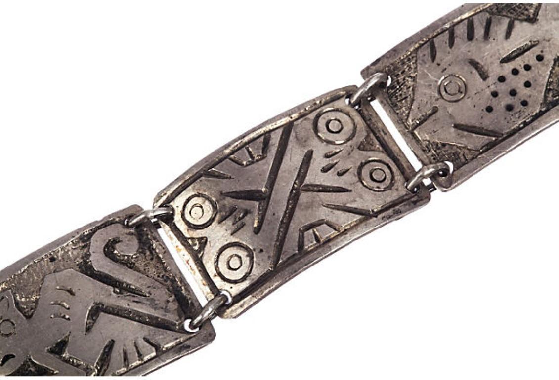 1950s handmade silver bracelet with incised primitive images of animals. Weight: 29.8 grams. Closes with hook clasp. Signed, “Ecuador, 900” for silver content. Acid tested for silver.
