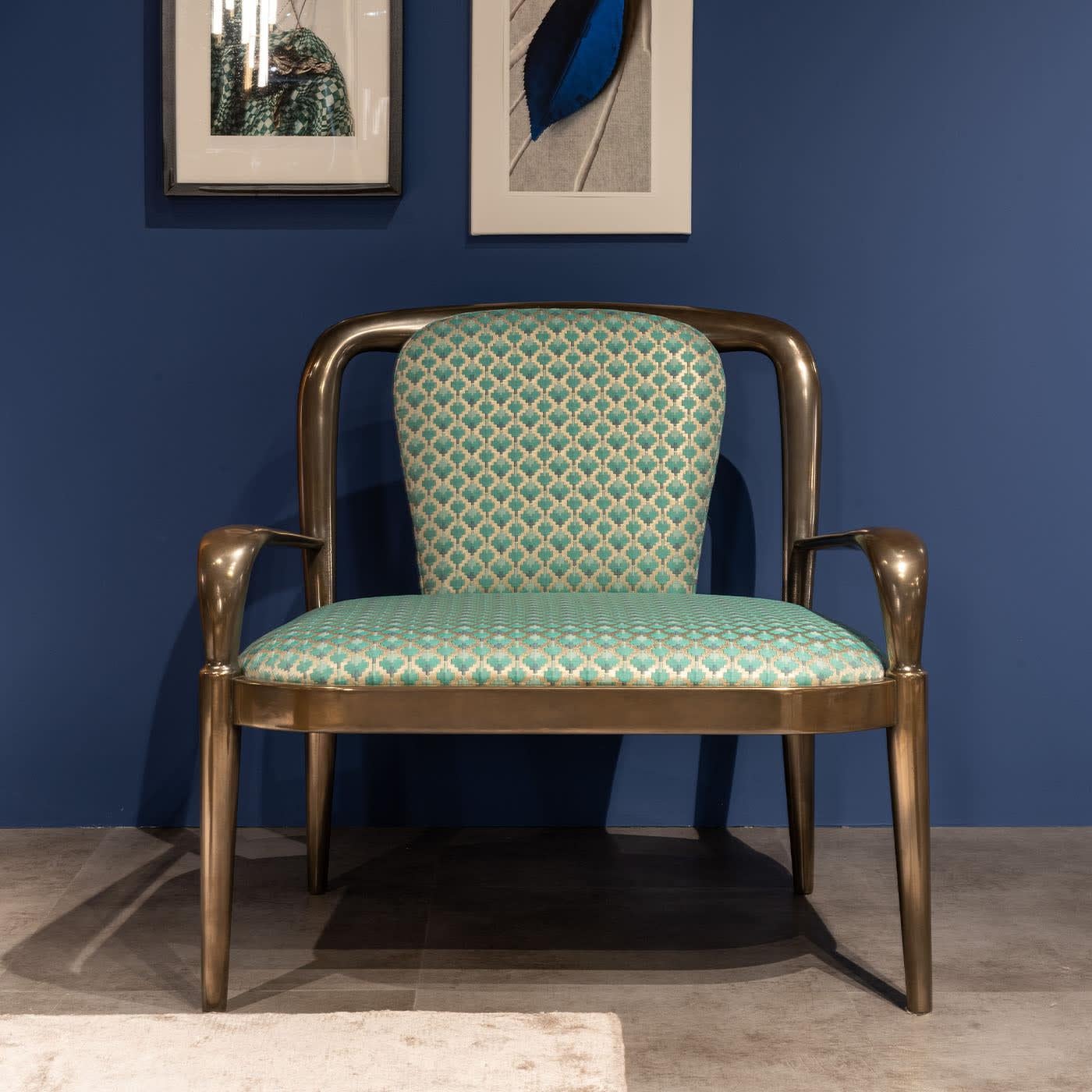 Exuding vintage flair, this armchair is an invitation to pure relaxation. A sophisticated oxidized bronze finish enhances the Canalleto walnut frame's seductive curves, which embrace a richly padded seat and backrest. Sealed by a hypnotizing,