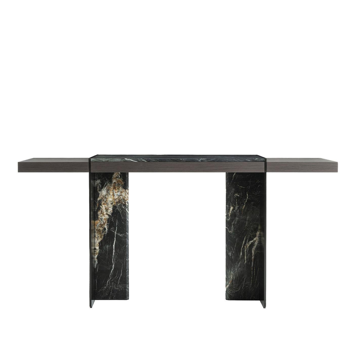 Rigorously intersecting volumes define the sculptural silhouette of this console design, revealing its unique allure through the extensive use of prized Belvedere marble. Black metal details in a sophisticated brushed finish enrich the piece, which