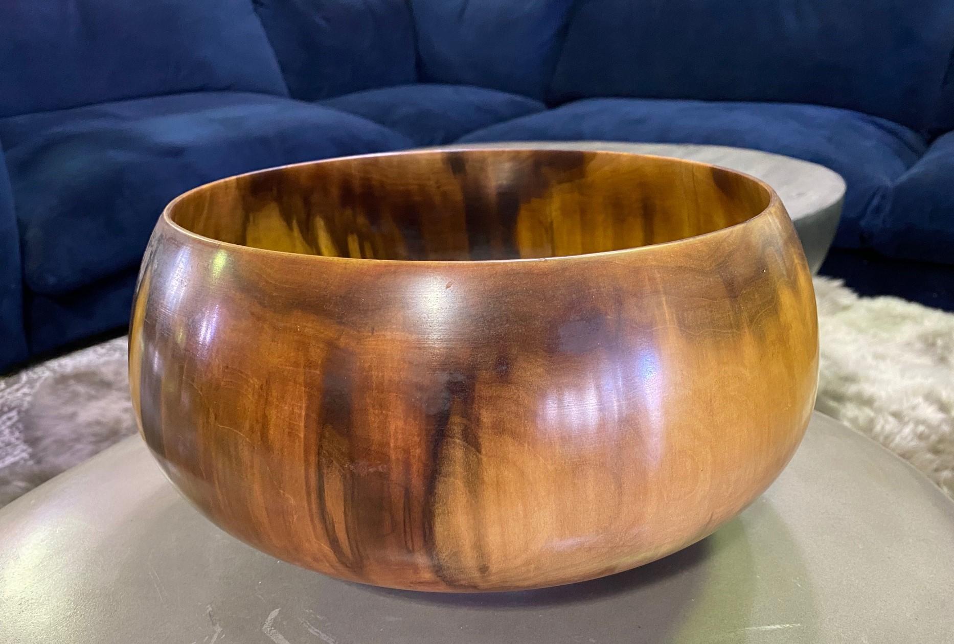 A magnificent work by 20th century master wood-turner/artist Ed Moulthrop who is recognized as the father of modern woodturning, and credited with moving woodturning from a simple craft to an art form. 

The tulipwood bowl is signed and