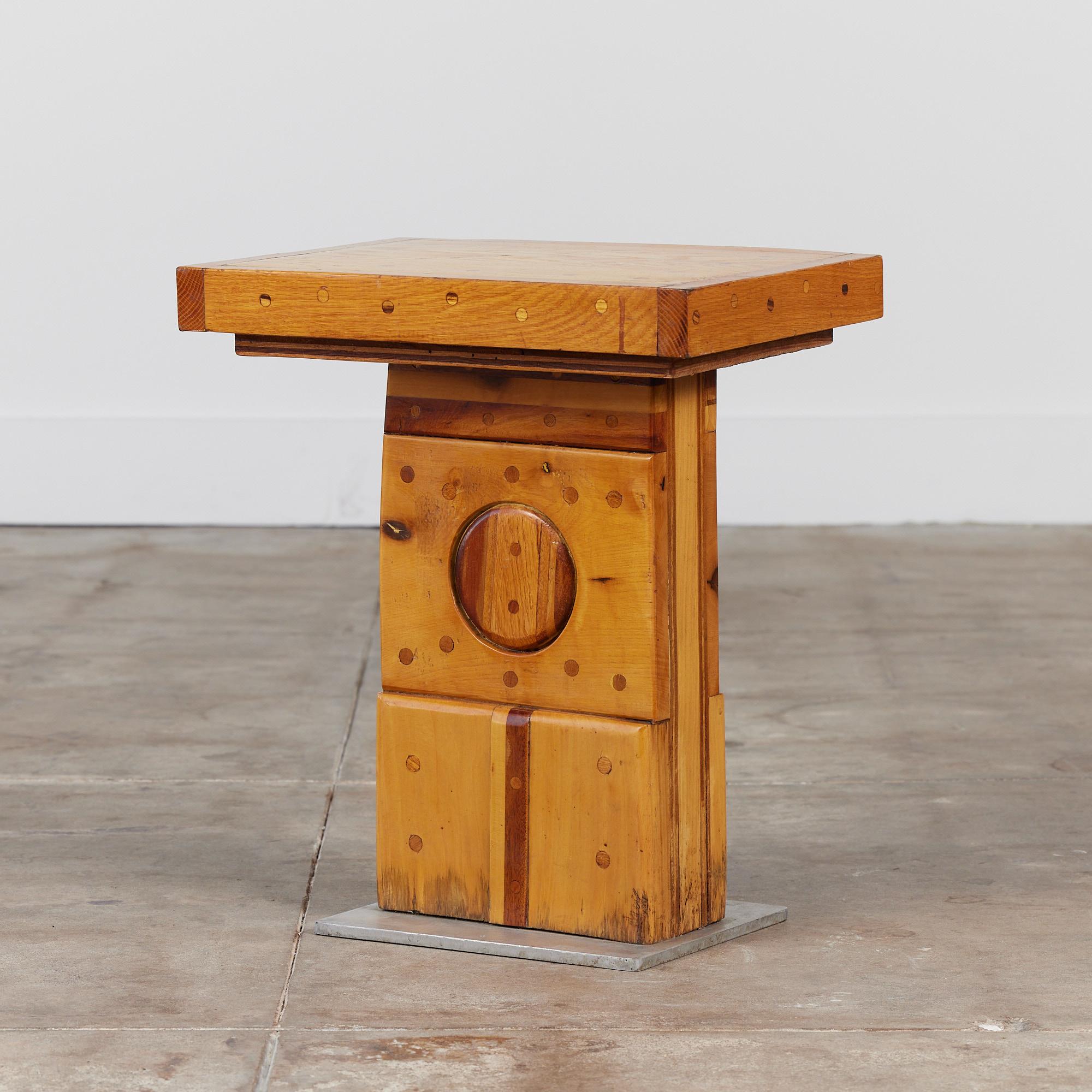 Pedestal side table by Ed Hart, circa 1970s, California. Ed, a sculptor from Newport Beach, California, created this unique pedestal side table, with many geometric sculptural elements. The mix of oak and pine offer varying depths in coloring
