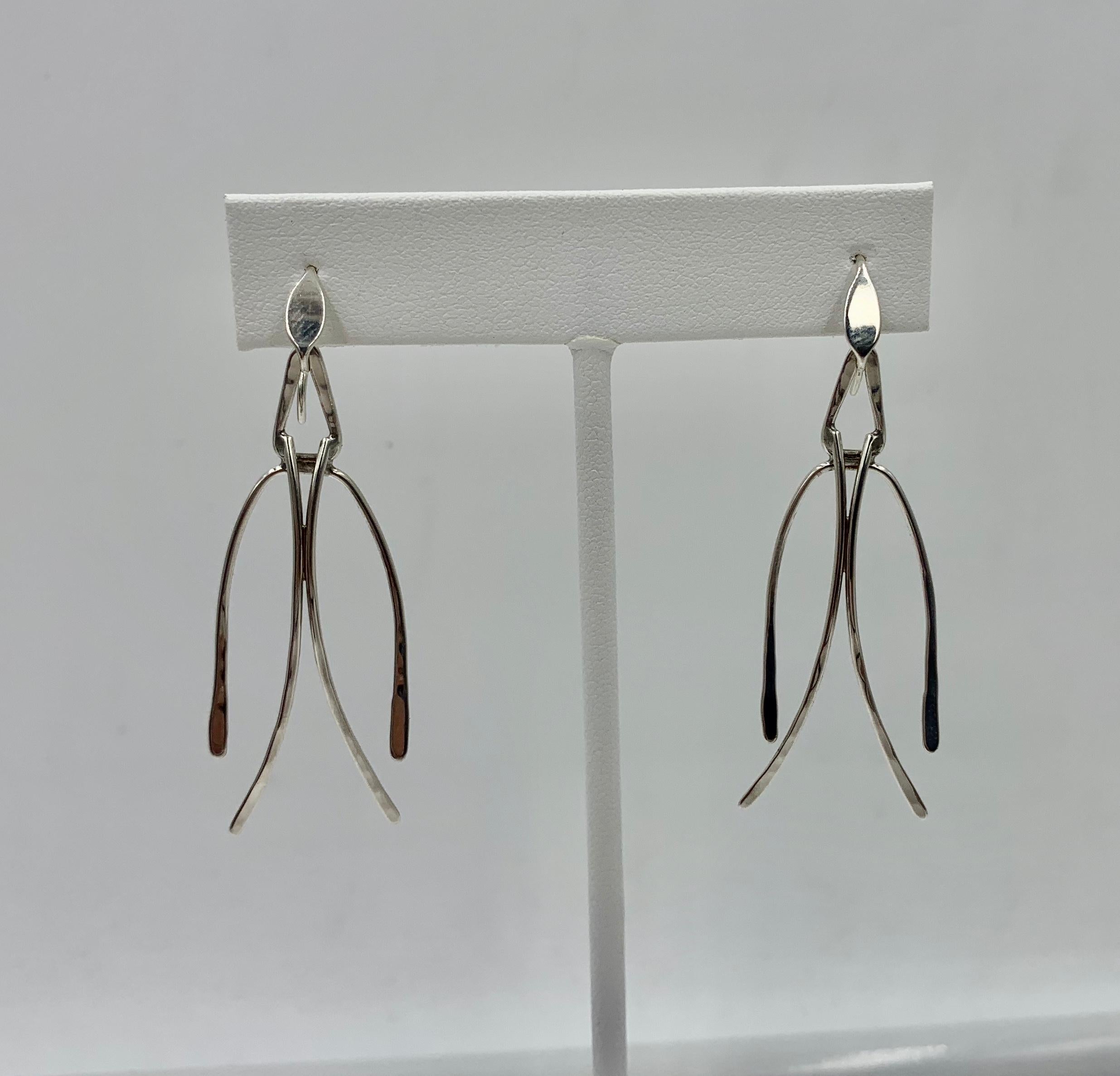 A stunning pair of signed Ed Levin Mid-Century Modernist Dangle Drop Earrings in Sterling Silver.  The earrings with classic Ed Levin design which dangle wonderfully from the ear.  I love this design so full of kinetic energy.  The earrings are