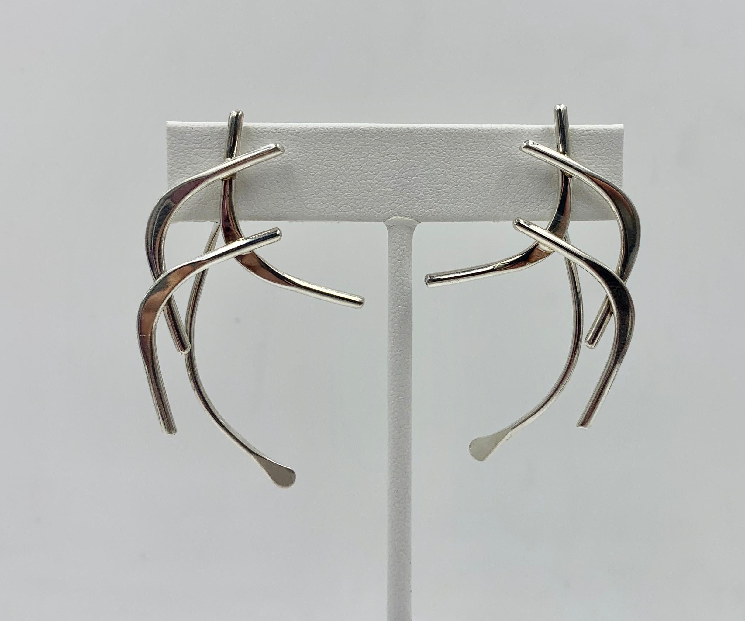 A stunning pair of signed Ed Levin Mid-Century Modernist Dangle Drop Earrings in Sterling Silver with 14 Karat Gold Posts.  The earrings with classic Ed Levin design with one of the dangle sections attached to the back so it dangles from the reverse