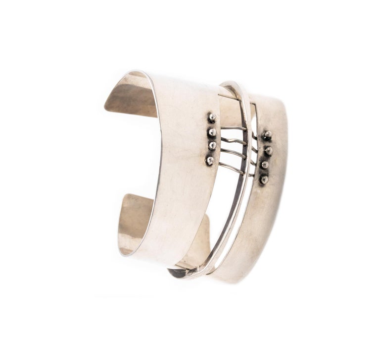 A cuff bracelet designed by Ed Wiener (1918-1991).

This rare sculptural modernist piece is one of Wiener's first creations as a jeweler-artist in New York city, circa 1950's. This bracelet is composed by six elements with sinuous curved and free