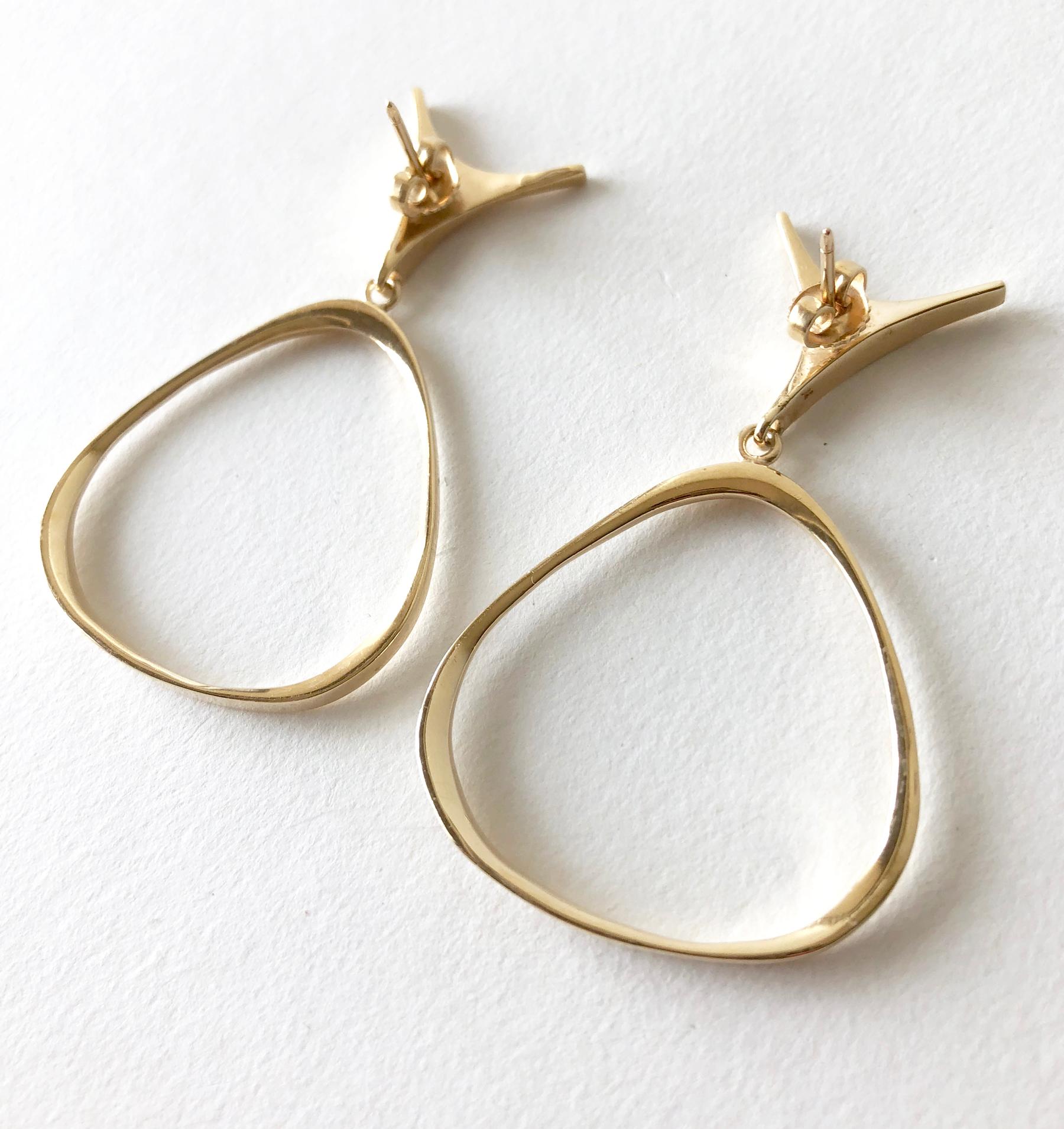 1950's abstract modernist 14k gold pierced earrings created by Ed Wiener of New York, New York.  Earrings measure 2 1/8