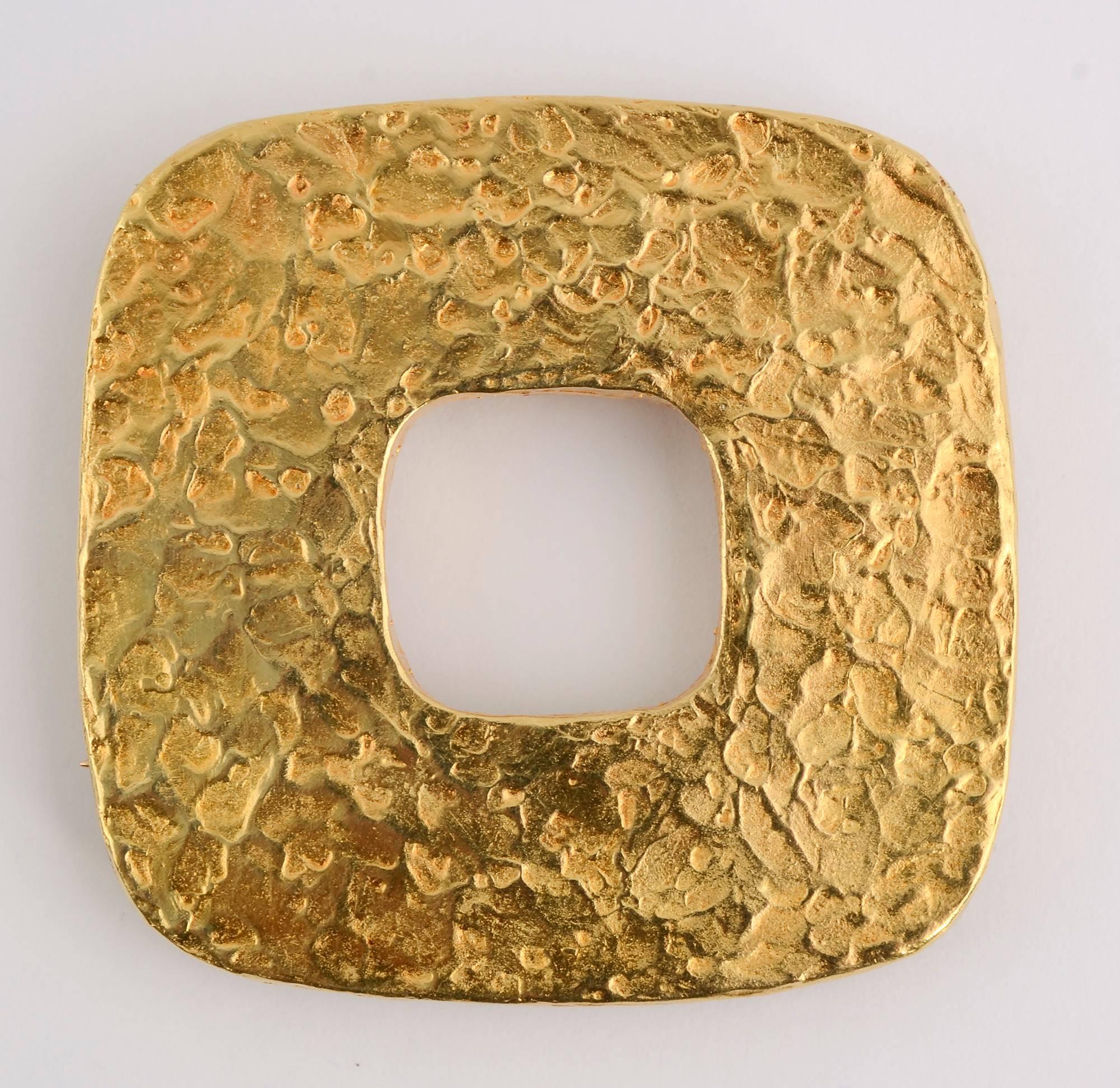 Highly textured and versatile pendant/ brooch by famed Modernist designer, Ed Wiener.
The piece has loops so that it can be hung on a chain either on square or on point. The pin stem is for it to be worn on square.
The piece weighs 39 grams. It