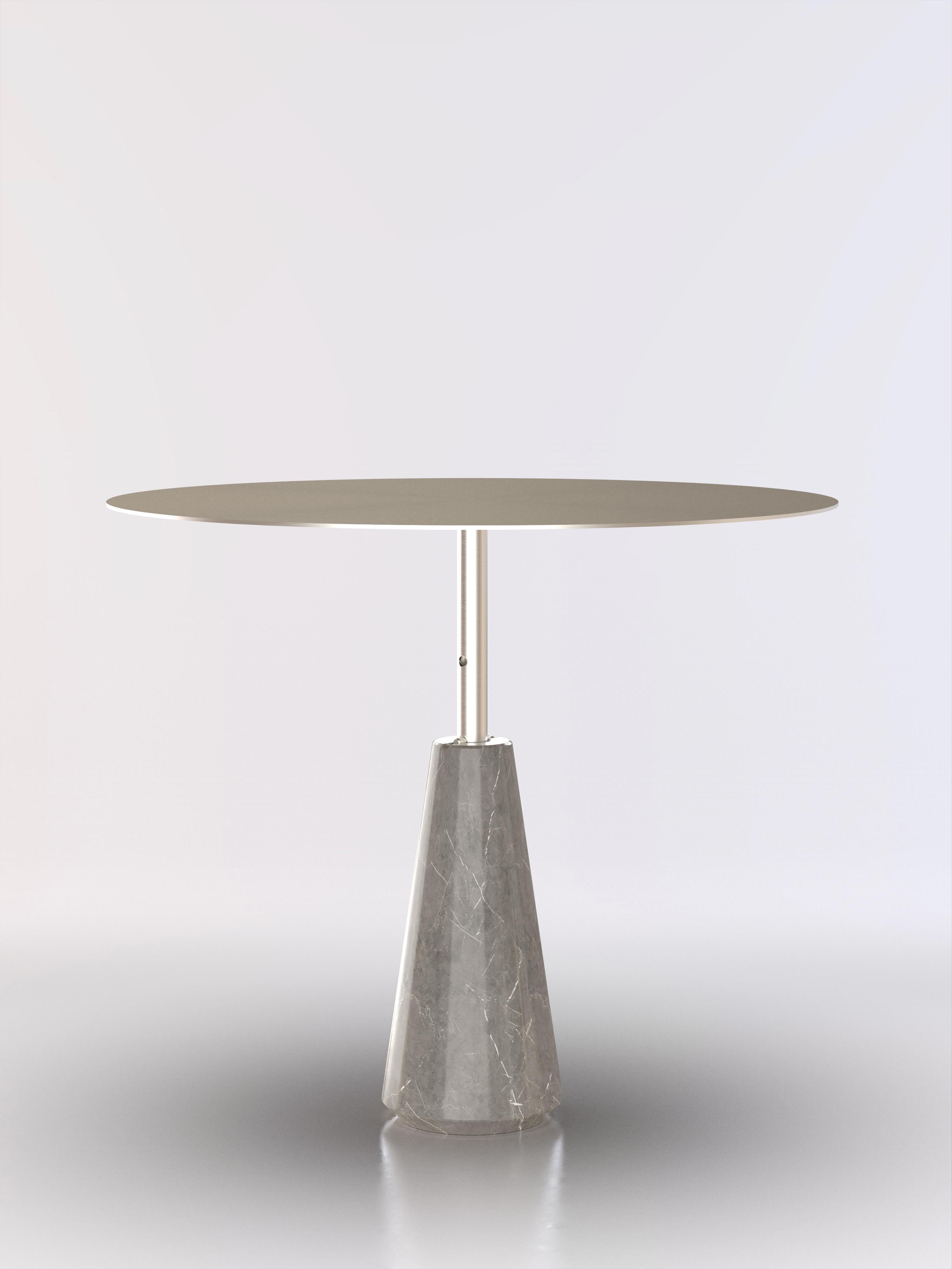 Reconfigurable steel side table with grey stone base.
The table's height can be set in three different levels.