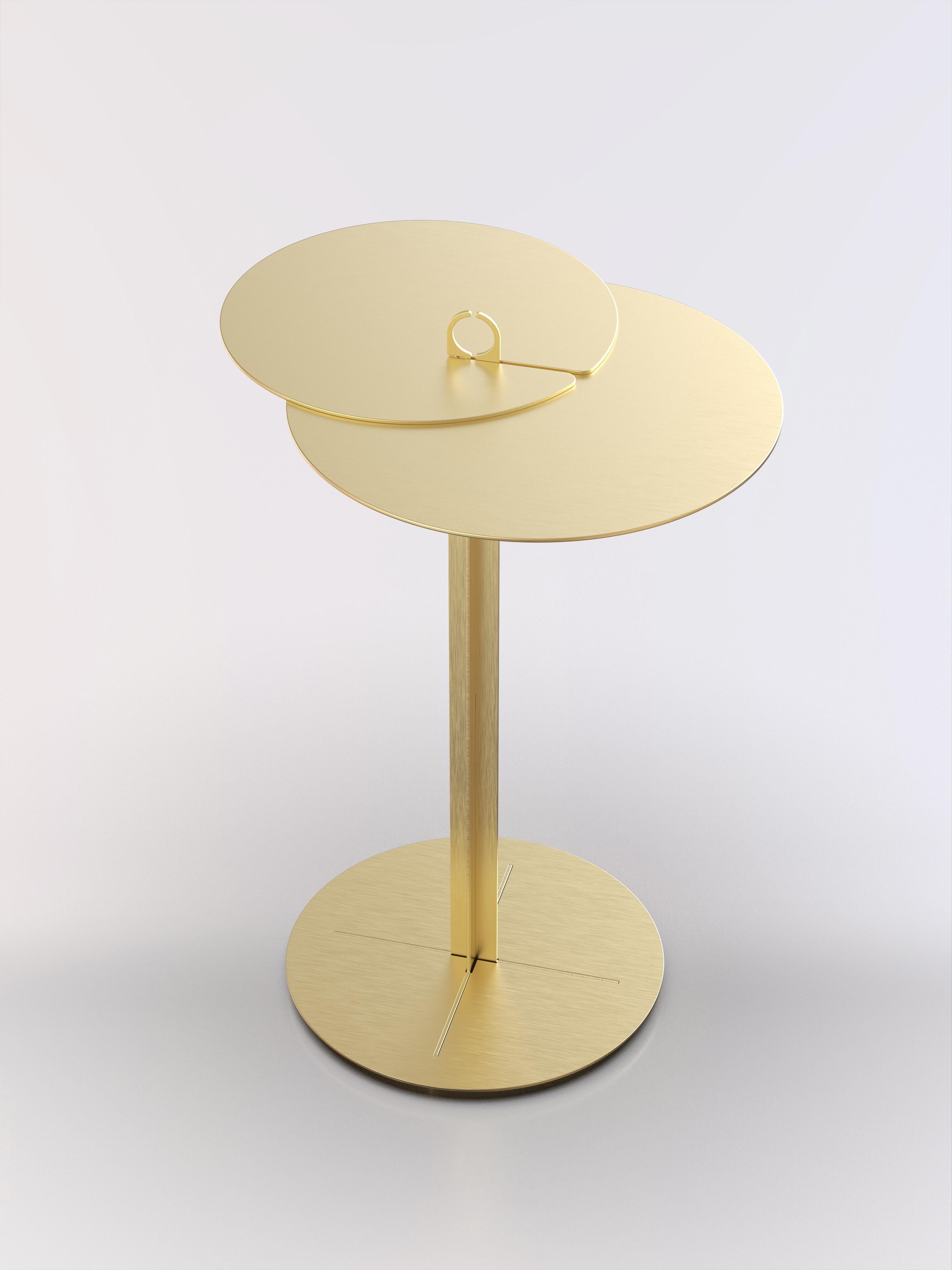 Side table made in lasercut metalsheet with an interlock brushed brass structure.
