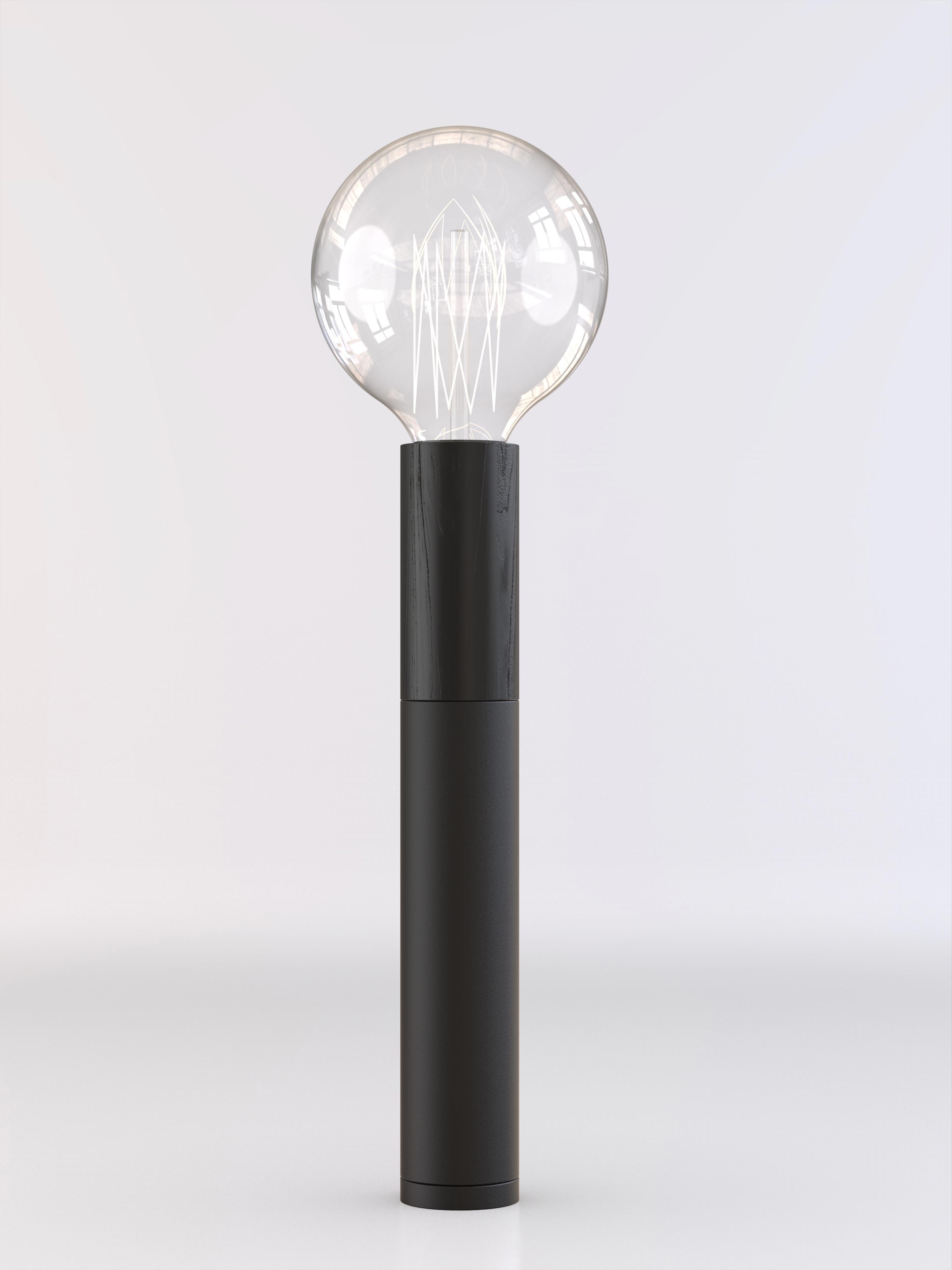 Table lamp with black wood and black paint structure.