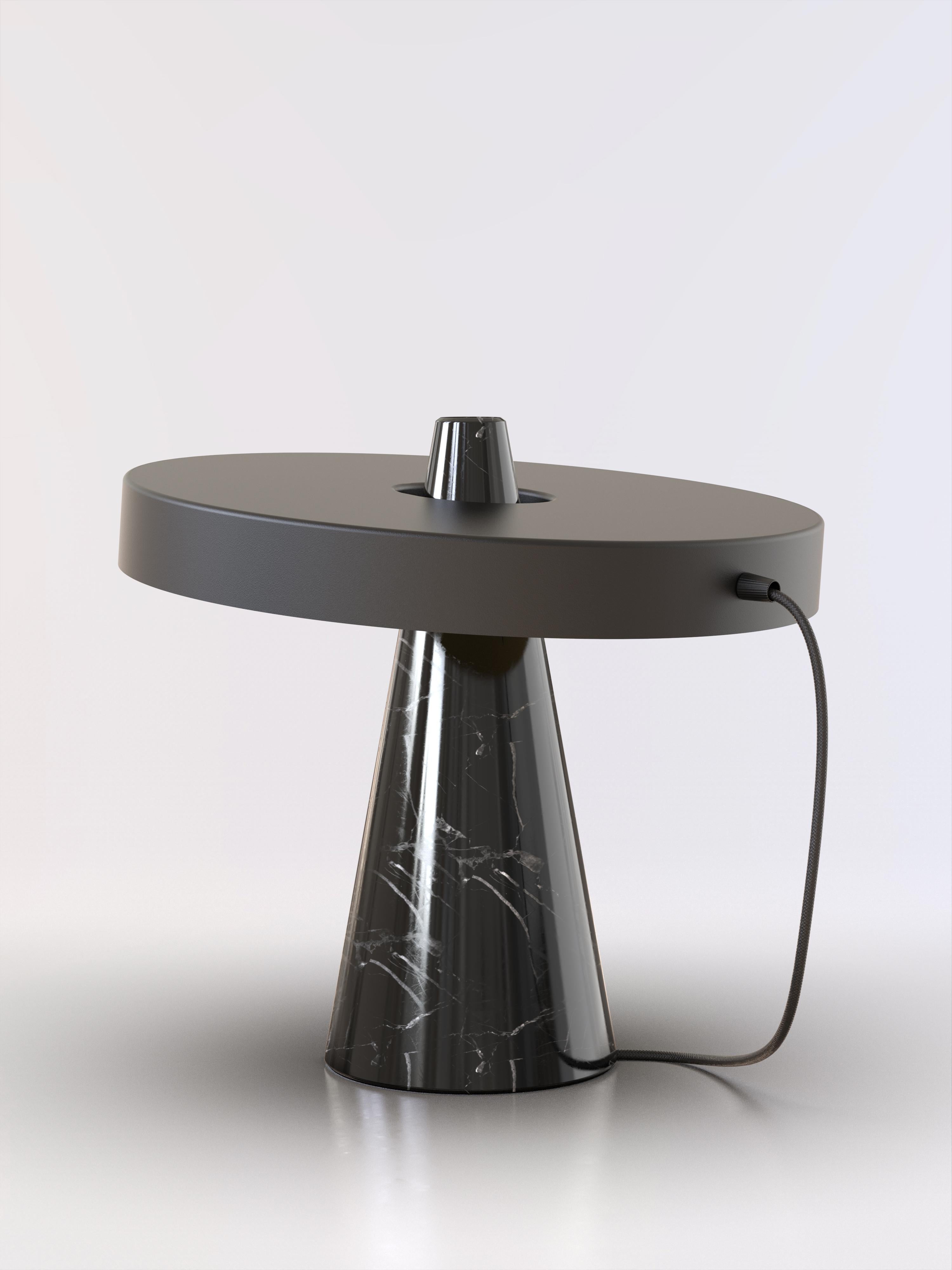 Table lamp with Marquinha black stone base and black paint lightshade.
The light shade is disconnected from the stone base and free to tilt, allowing multiple change of styles.