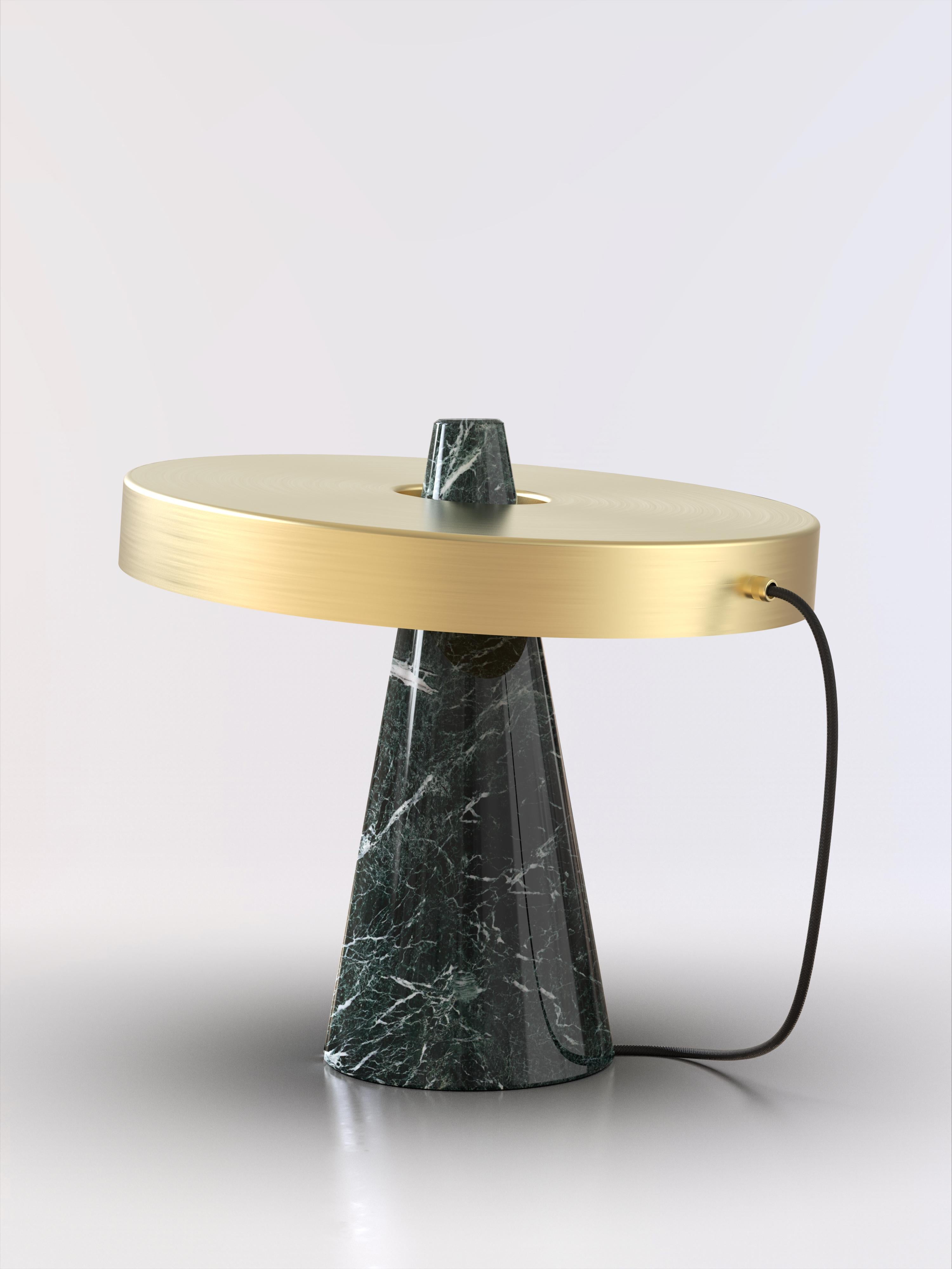 Table lamp with Guatemala green stone base and brushed brass lightshade.
The light shade is disconnected from the stone base and free to tilt, allowing multiple change of styles.