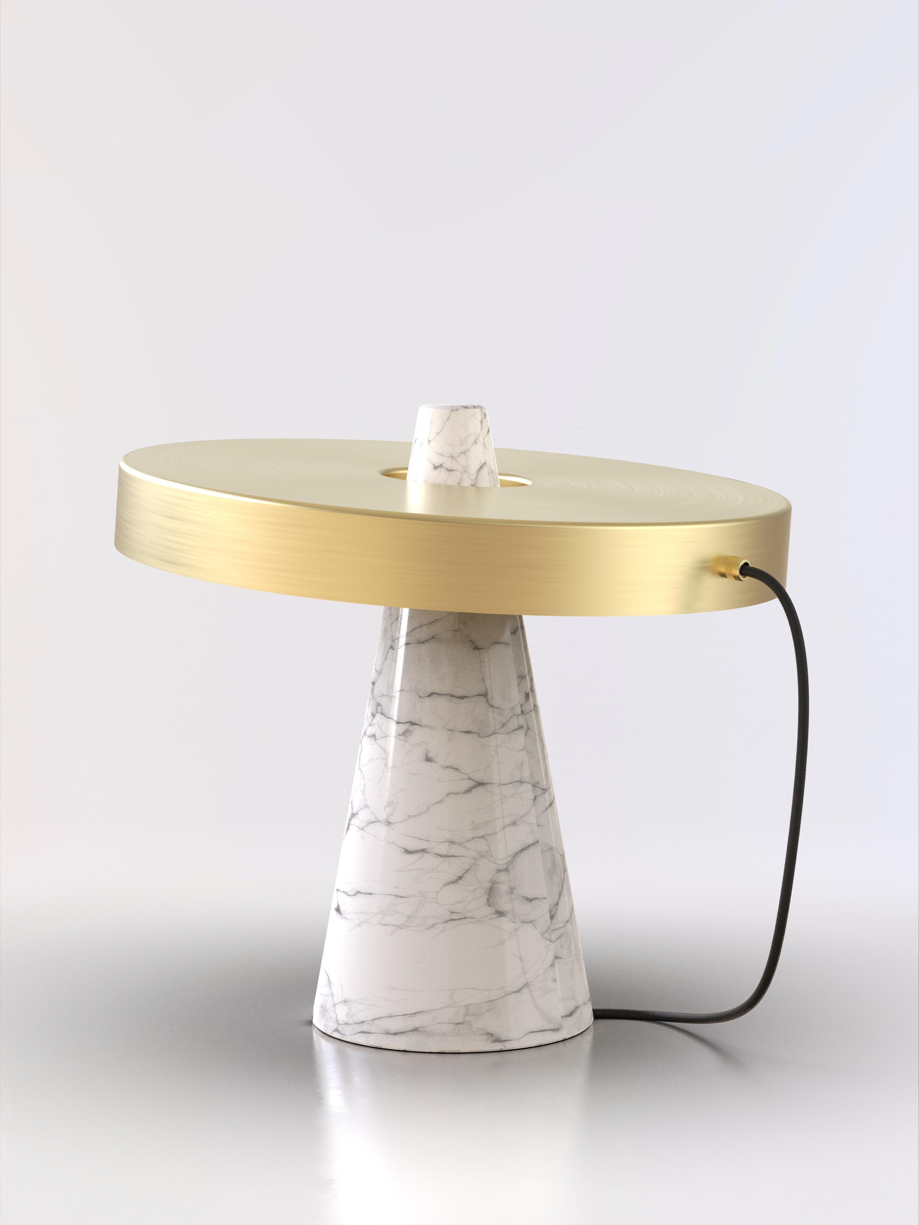 Table lamp with Carrara white stone base and brushed brass lightshade.
The light shade is disconnected from the stone base and free to tilt, allowing multiple change of styles.