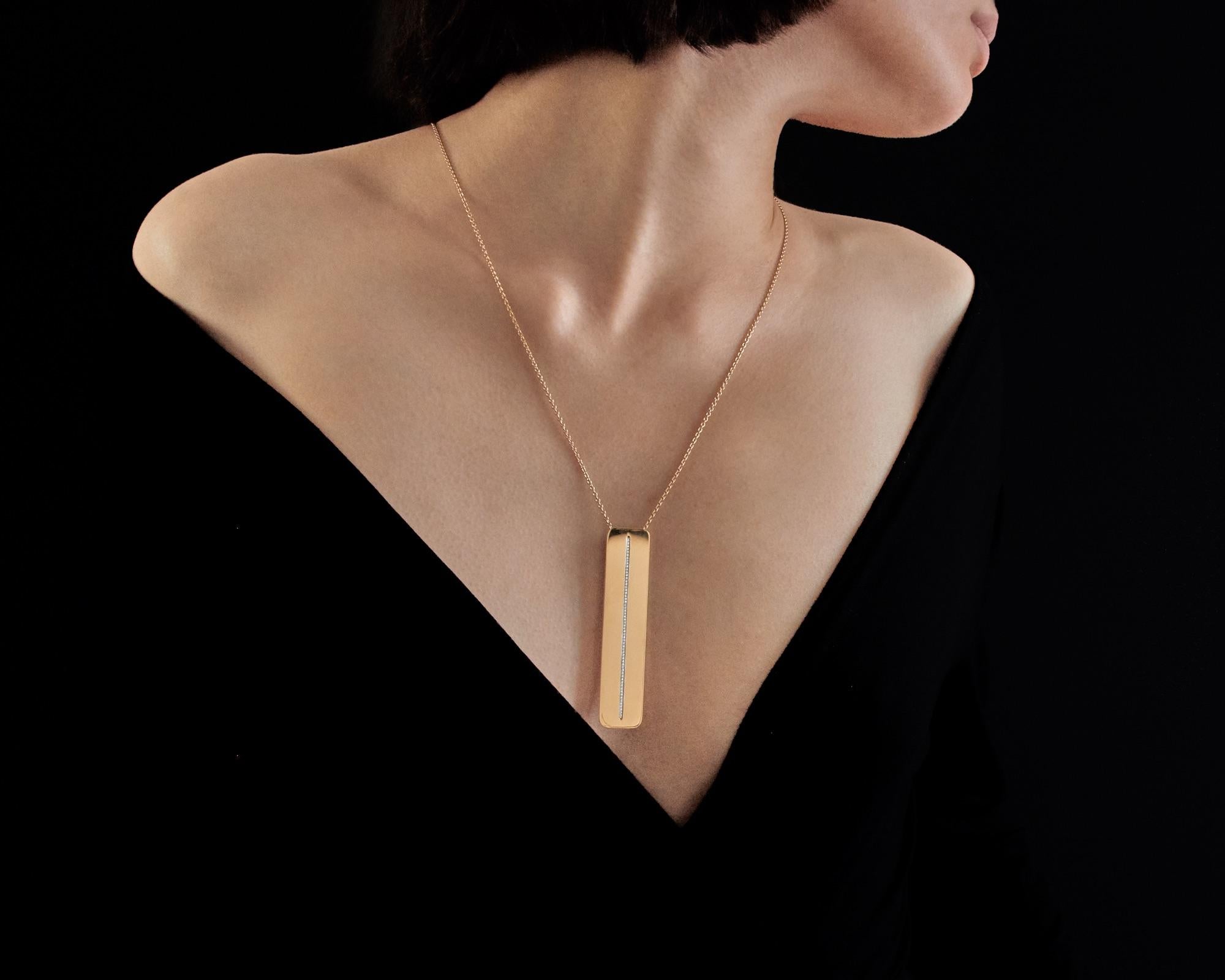 Handcrafted in France in our High Jewelry Paris workshop. Titled  “Gravity” and designed by Édéenne, artist and founder of Maison Édéenne, the truly one-of-a-kind pendant is a 18K yellow gold minimalist plate of 8 cm by 1.7 cm (3.15 by 0.67 inch)