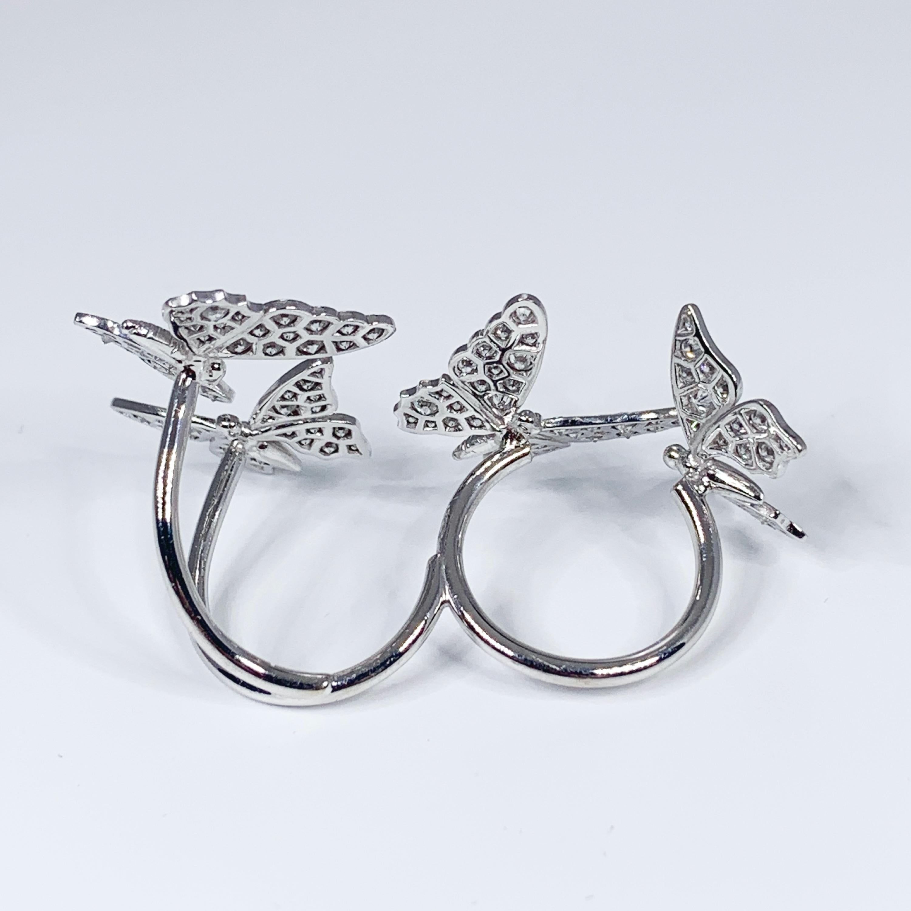 two butterfly between the finger ring