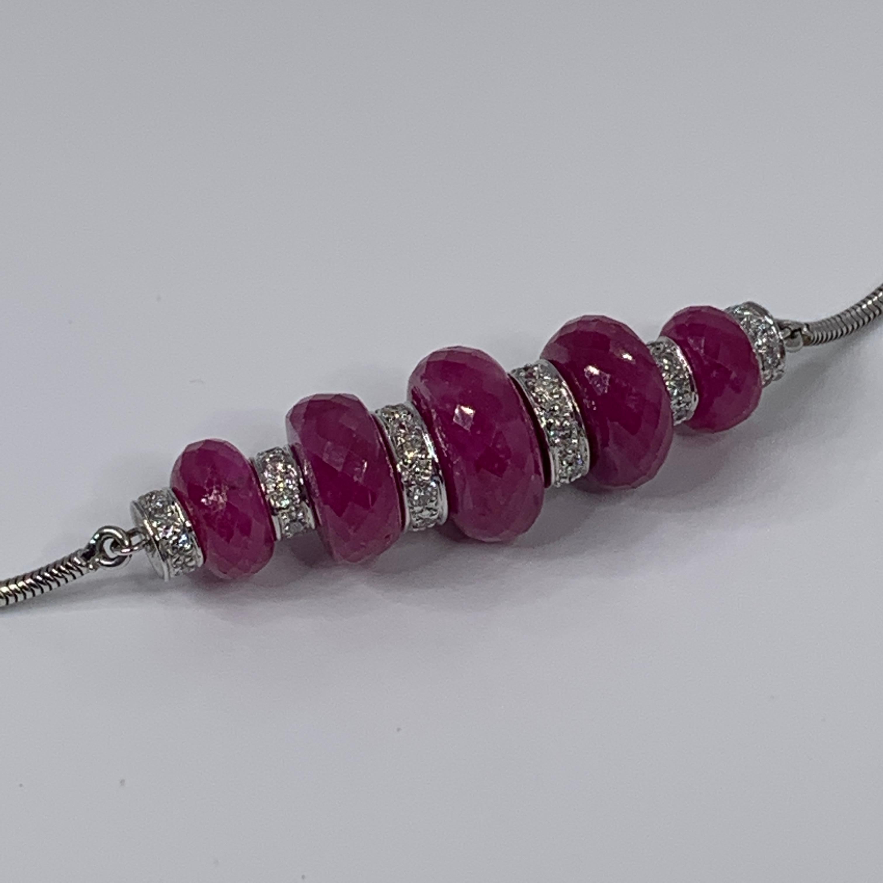 Handcrafted in Paris in the Maison Édéenne High Jewelry workshop, this pendant is in 18K white gold and set with 5 pearls of Ruby Root totaling 29.33 carat and white diamonds totaling 0.65 carat. It hangs on a 45 cm / 17 inches chain in the same 18K