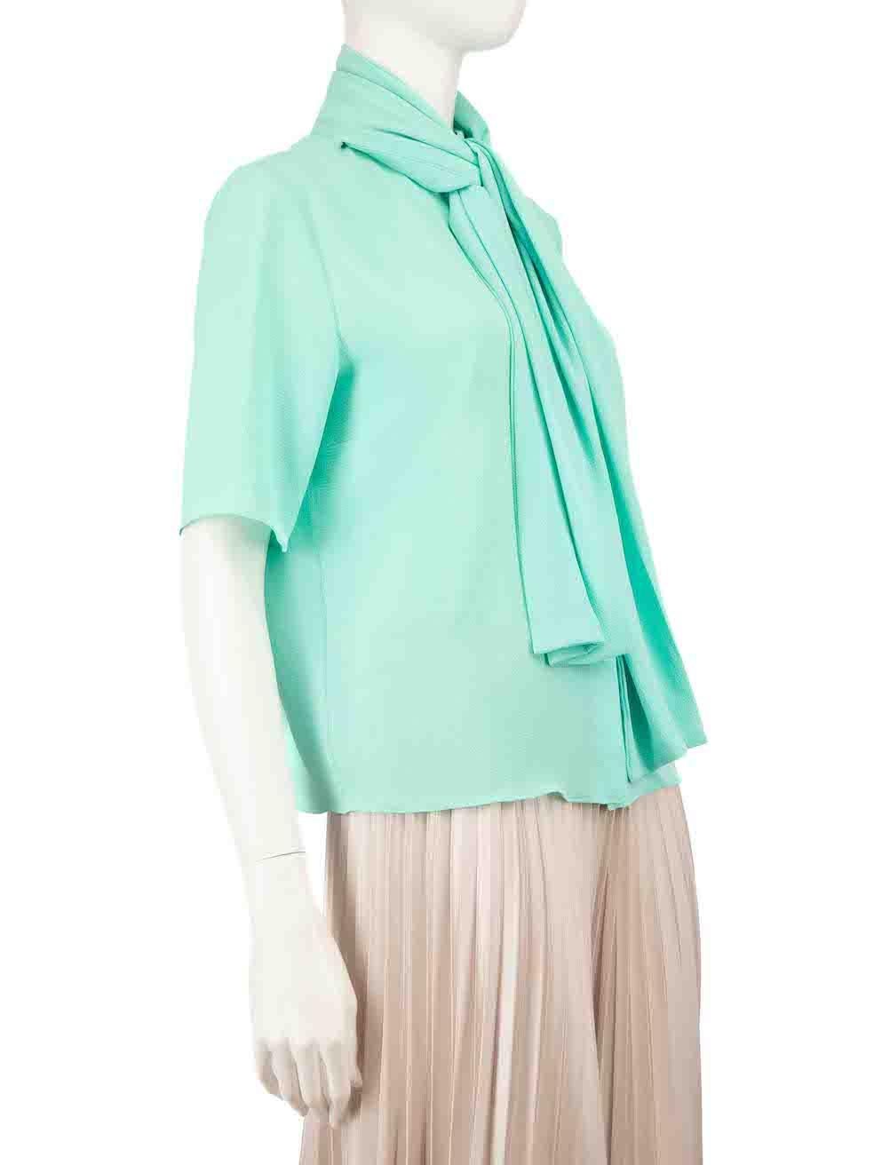 CONDITION is Very good. Minimal wear to blouse is evident where a tiny mark is seen to the left side of scarf on this used Edeline Lee designer resale item.
 
 
 
 Details
 
 
 Turquoise
 
 Polyester
 
 Blouse
 
 Short sleeves
 
 Front button up