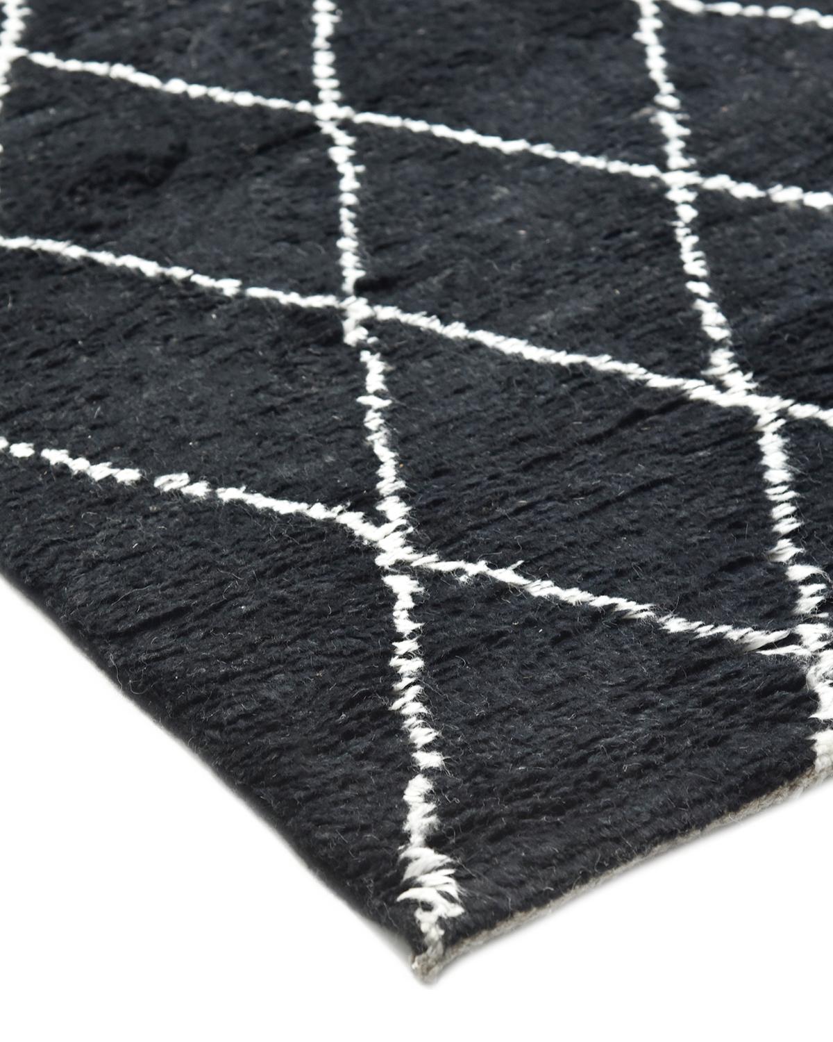 Color: Black, made in: India. 80% wool, 20% cotton. Morocco’s rug-making heritage encompasses everything from plush, neutral Beni Ourains to colorful, lightweight kilims. Paying homage to traditional craftsmanship and centuries-old motifs, these