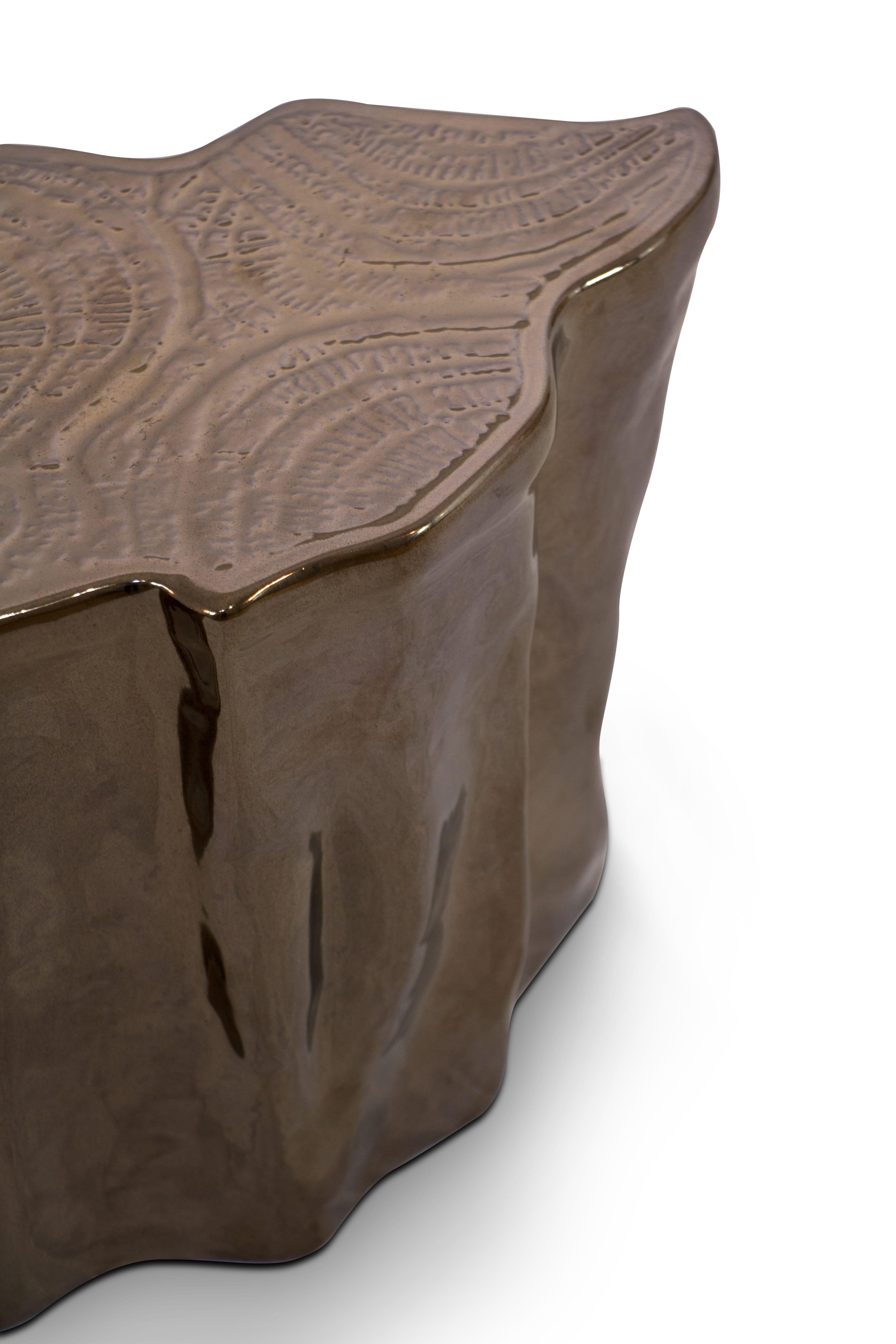 The mystic behind the name inspires Eden. A slice of the tree of life that fell from the Garden of Heaven, this accent coffee table set awakens desire and curiosity with its intriguing cut. 
Born from master artisans and the ancient technique of