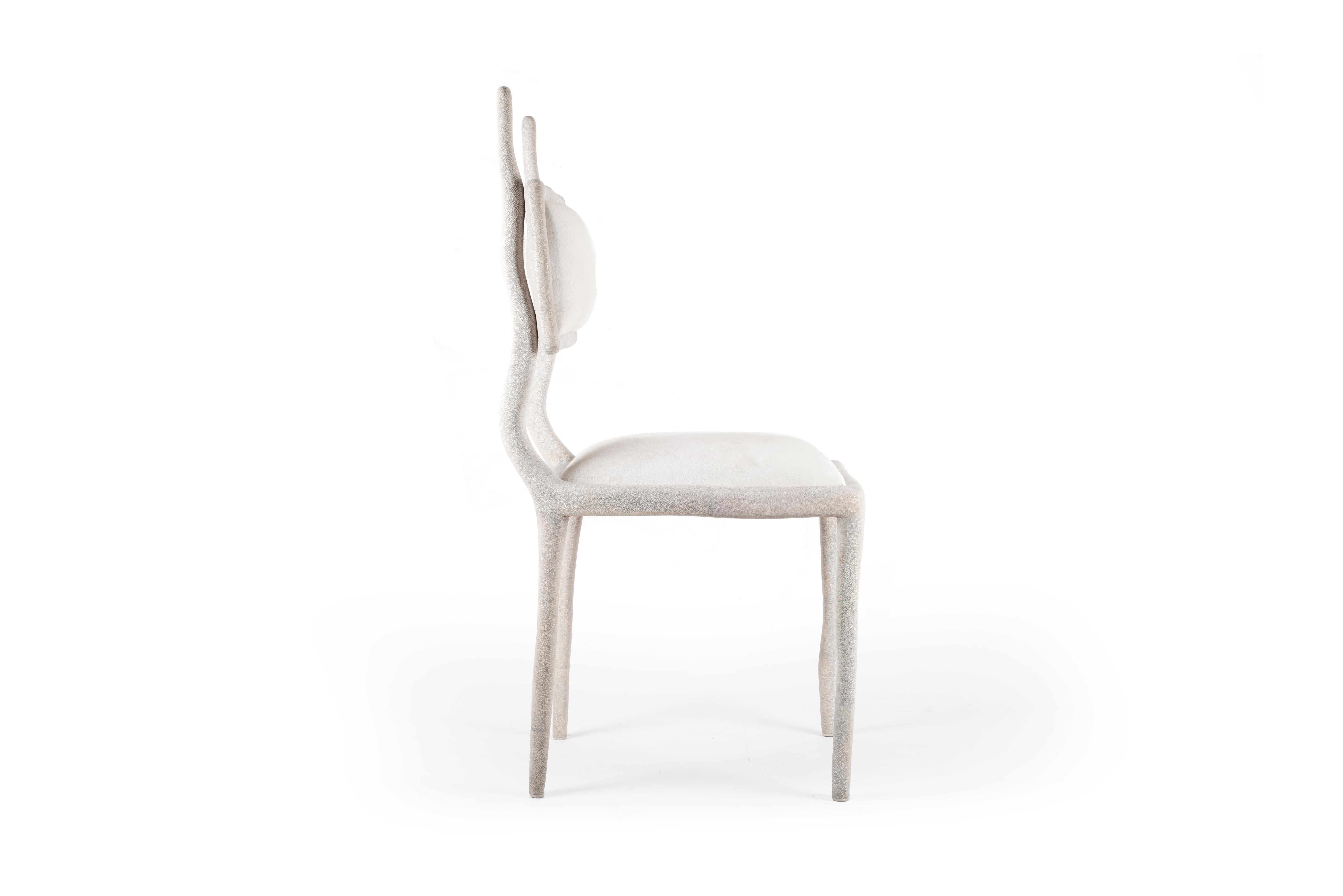 The Eden Chair in cream shagreen and upholstered in cream calf-hair adds the perfect balance between fantasy and modernity to any space. This chair can be used as an entrance piece accent or dramatized around a dining room table. The shagreen is