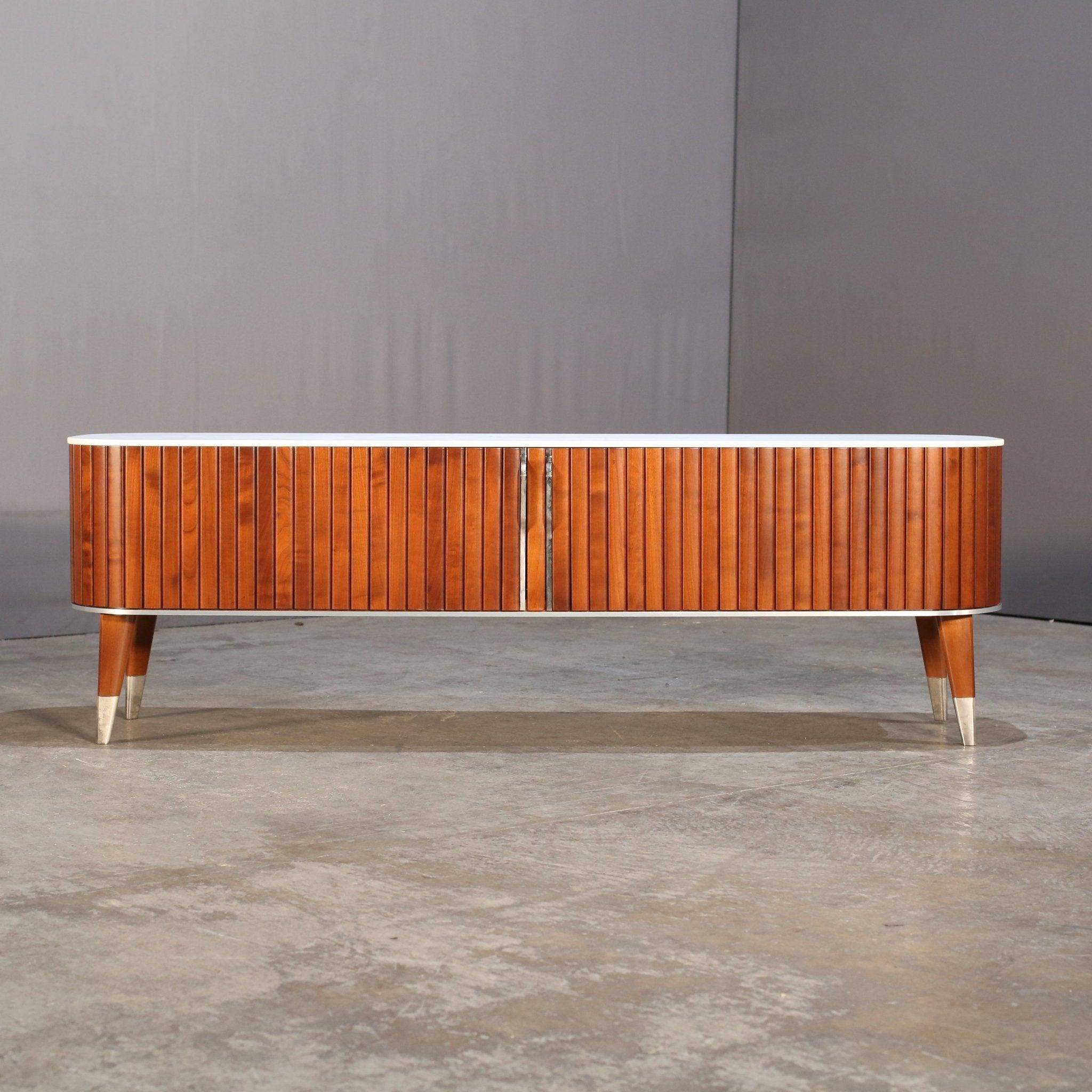 Introducing the ultimate in luxury media units - the Eden Rock Media Unit by Roche Bobois. This stunning piece features a sleek and modern design, crafted with the highest quality materials. The combination of wood creates a unique and sophisticated