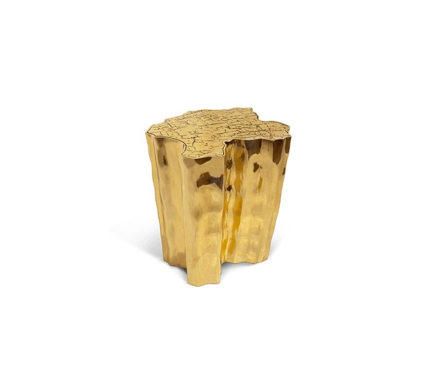 Eden is inspired by the mystic behind the name. This side table represents a part of the tree of knowledge and the tale of the birth of desire. Fully made of polished casted brass, with a delicately engraved top exposing the heart of a golden tree
