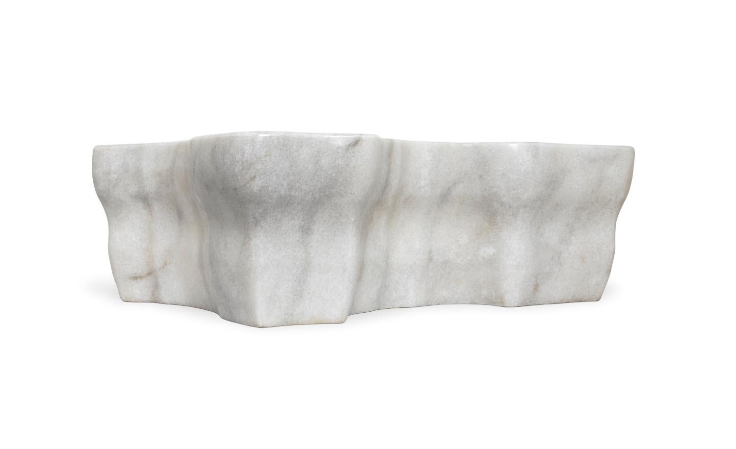 The Eden stone vessel sink is inspired by the shape of a tree stump. This beautiful irregular shaped piece is carved from our finest marble selection. When looking for the perfect element to distinguish your bathroom project, the Eden stone vessel