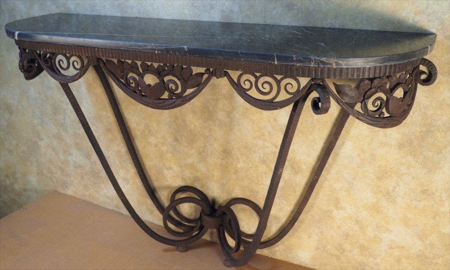 Classic French Art Deco console by Edgar Brandt, circa 1925, in forged iron with original marble top. Titled Simplicite,. Stamped E. Brandt and documented.

Measures: 55 W x 15 D x 33 H.

Edgar Brandt

(1880-1960)

Edgar Brandt was born in