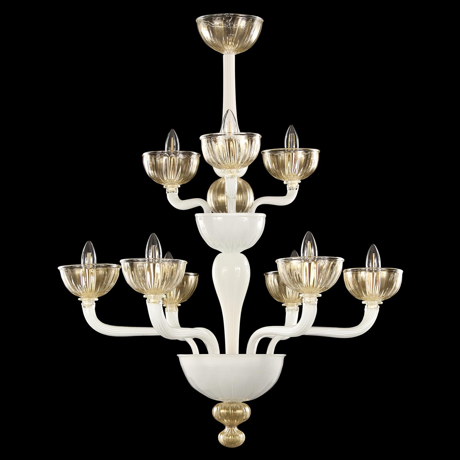 Edgar chandelier, 6+3 lights, double tier white encased rigadin Murano glass gold details by Multiforme
Edgar Murano glass chandelier is one of those chandeliers in our collections that stands out thanks to its harmonious and balanced shapes. We