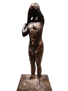 Dancer fastening the shoulder strap of her bodice – Edgar Degas, bronze cast by