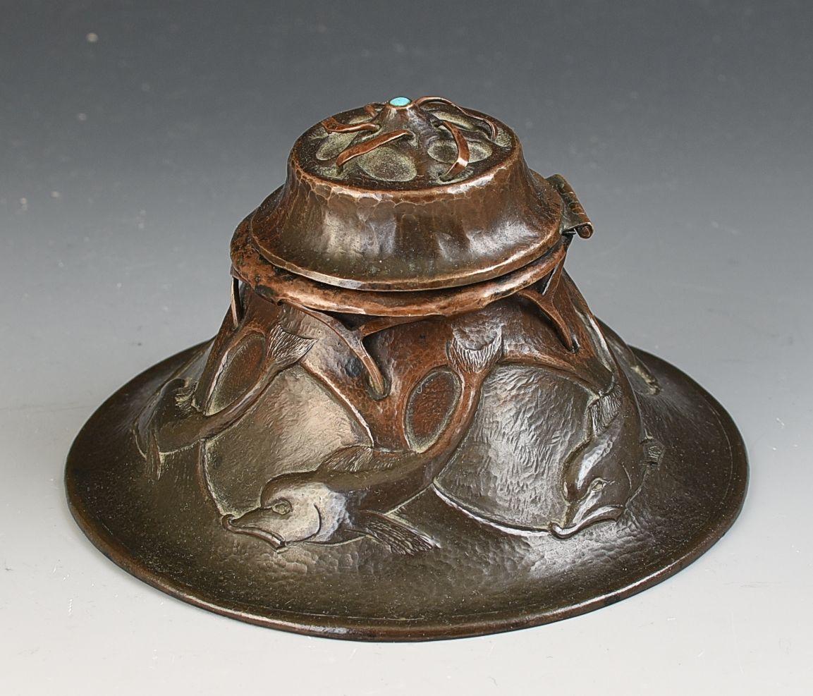 A fantastic quality beaten copper with turquoise finial arts and crafts inkwell signed by Edgar Simpson. A superb jewellery designer whose workmanship is of the very highest quality and pieces like this almost impossible to find as they are so rare.