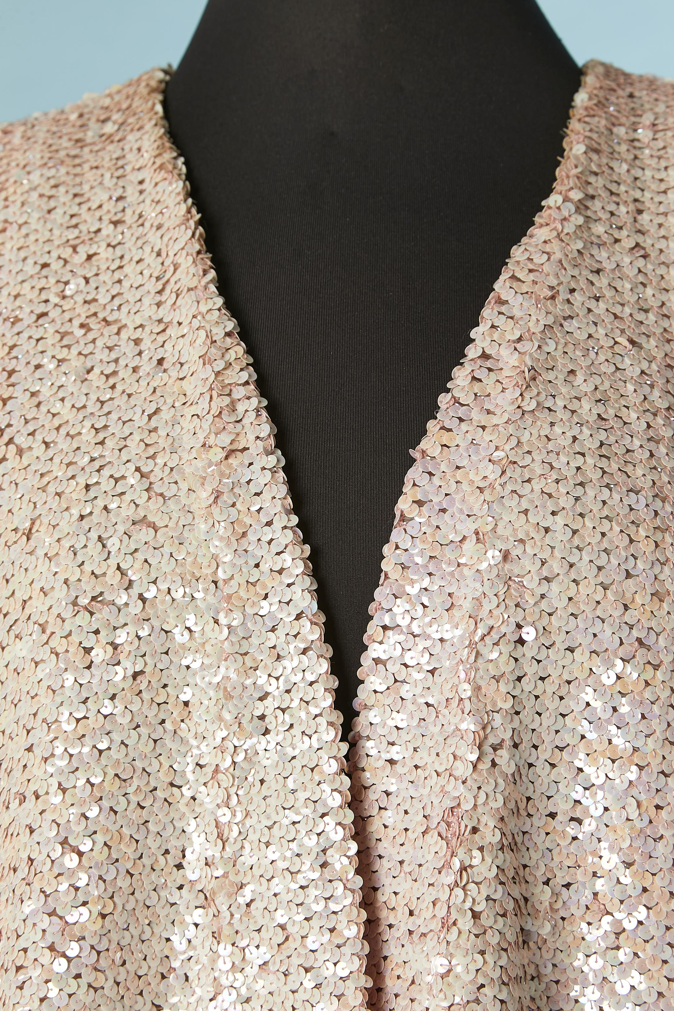 Pale pink sequins jacket with pocket on both side. No fabric composition tag but lining is probably acetate or rayon. 
SIZE 46 (Fr) 14 (Us) XL 