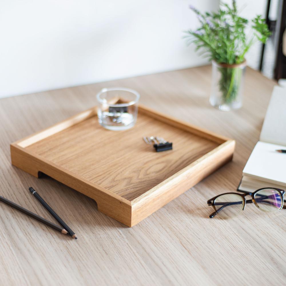 -The minimalist designed tray with hand holders allows for different uses, such as a serving tray in the kitchen or as a tray on which you can place decorative objects in the living room.
-Included in the Edge Series, this tray is made of oak wood.