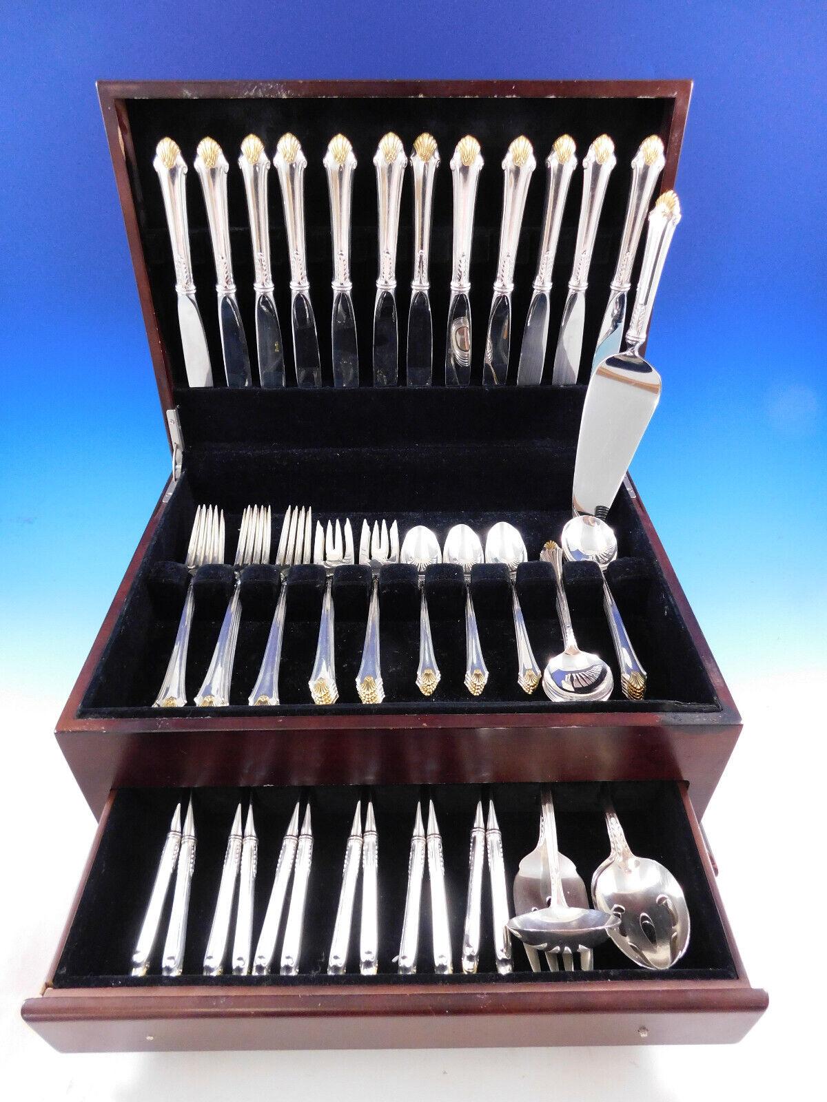 Originally issued in 1987, Edgemont Gold by Gorham has symmetrical flutes that adorn the end of the flatware, flaring in an unmistakable pattern.

Edgemont Gold Accent by Gorham sterling silver flatware set - 77 pieces. This set includes:

12