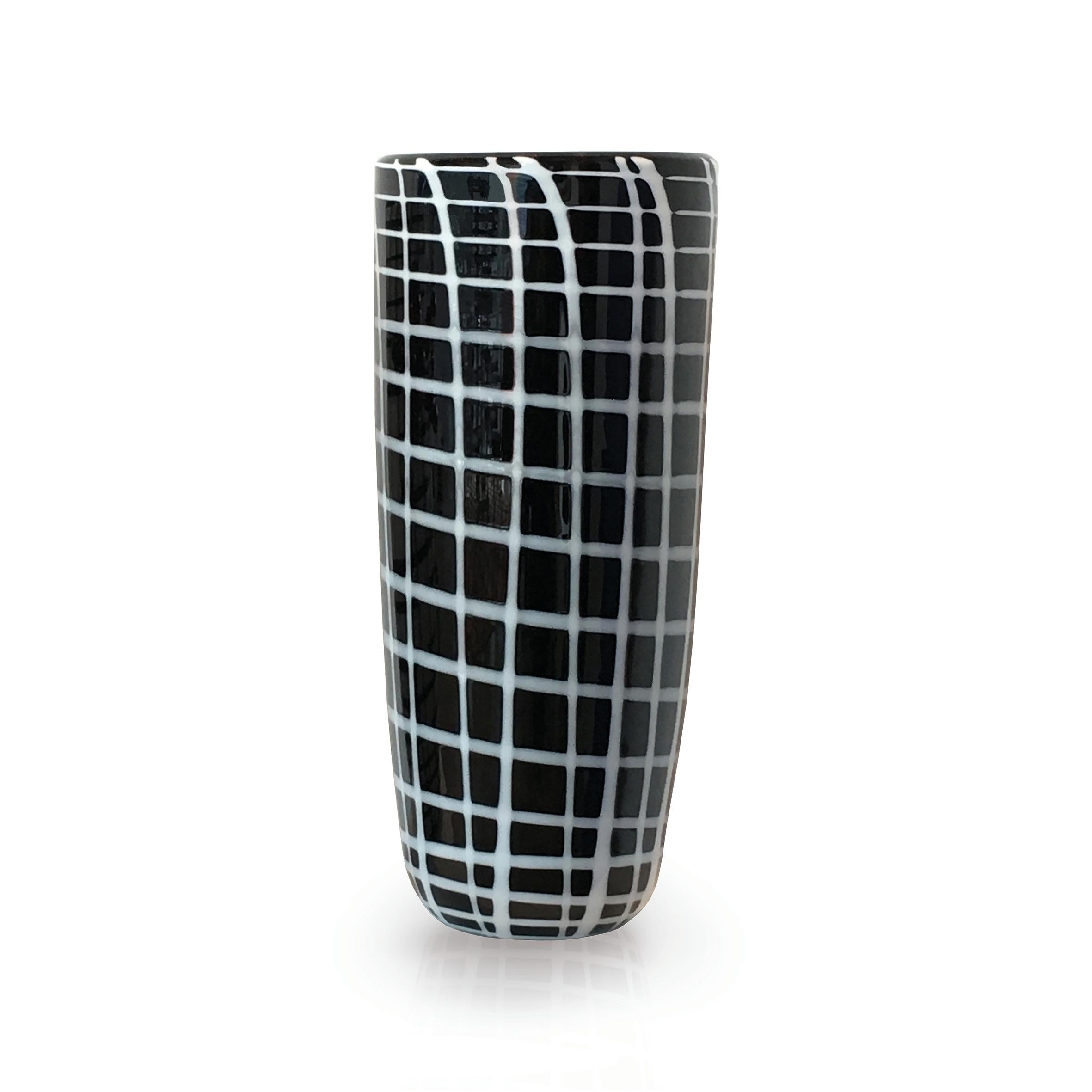 Edie black vase by Purho
Dimensions: D17 x H40 cm
Materials: Glass
Other colours available.

Purho is a new protagonist of made in Italy design , a work of synthesis, a research that has lasted for years, an Italian soul and an international