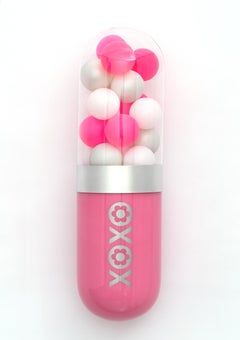 "Hugs & Kisses" (XOXO) pink glass pill sculpture