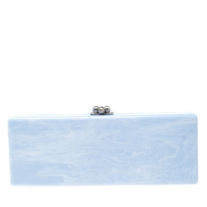 This clutch by Edie Parker is one you will love carrying around. It is subtle, captivating, and stylish. The clutch is made from acrylic and covered in soothing florals. The top opens to an interior where you can store your little