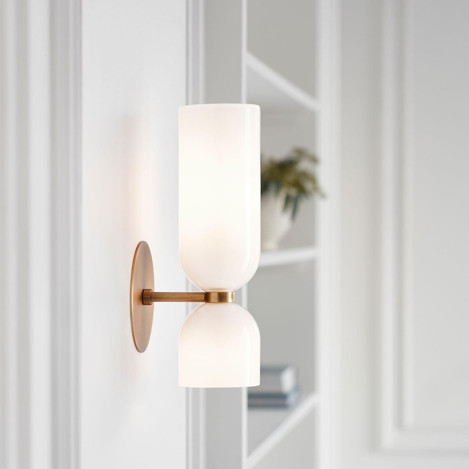 Edie explores the relationship between two similar forms. An exaggerated top column plays against the sconce’s overall sense of quiet restraint.

While Edie evokes a certain feeling of timelessness, it retains a fresh and modern presence.

Opal