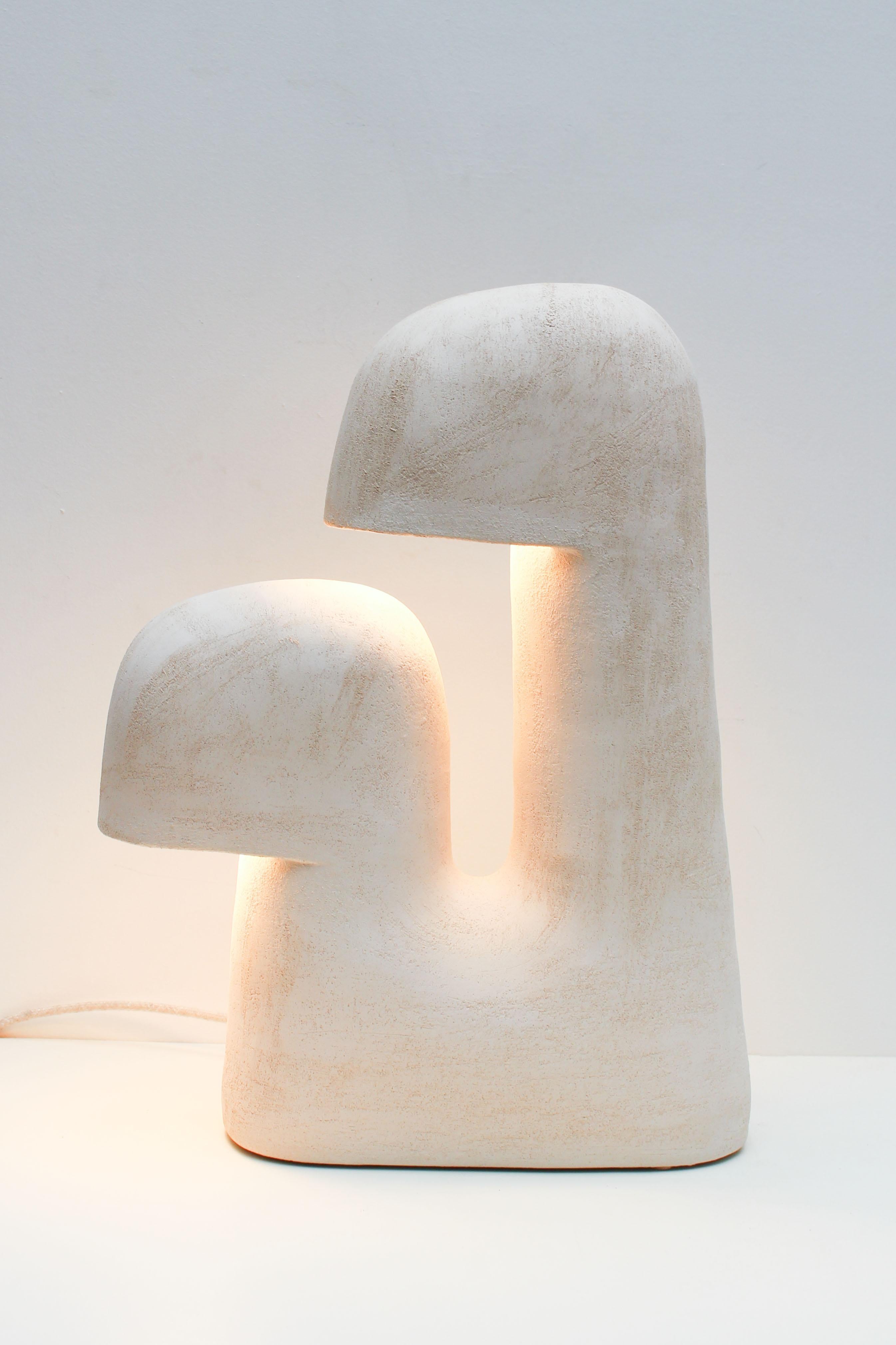Édifice white stoneware table lamp by Elisa Uberti
Materials: White Stoneware
Dimensions: 53 x 39 x 15 cm

After fifteen years in fashion, Elisa Uberti decides to take the time to work with these hands and to give birth to new