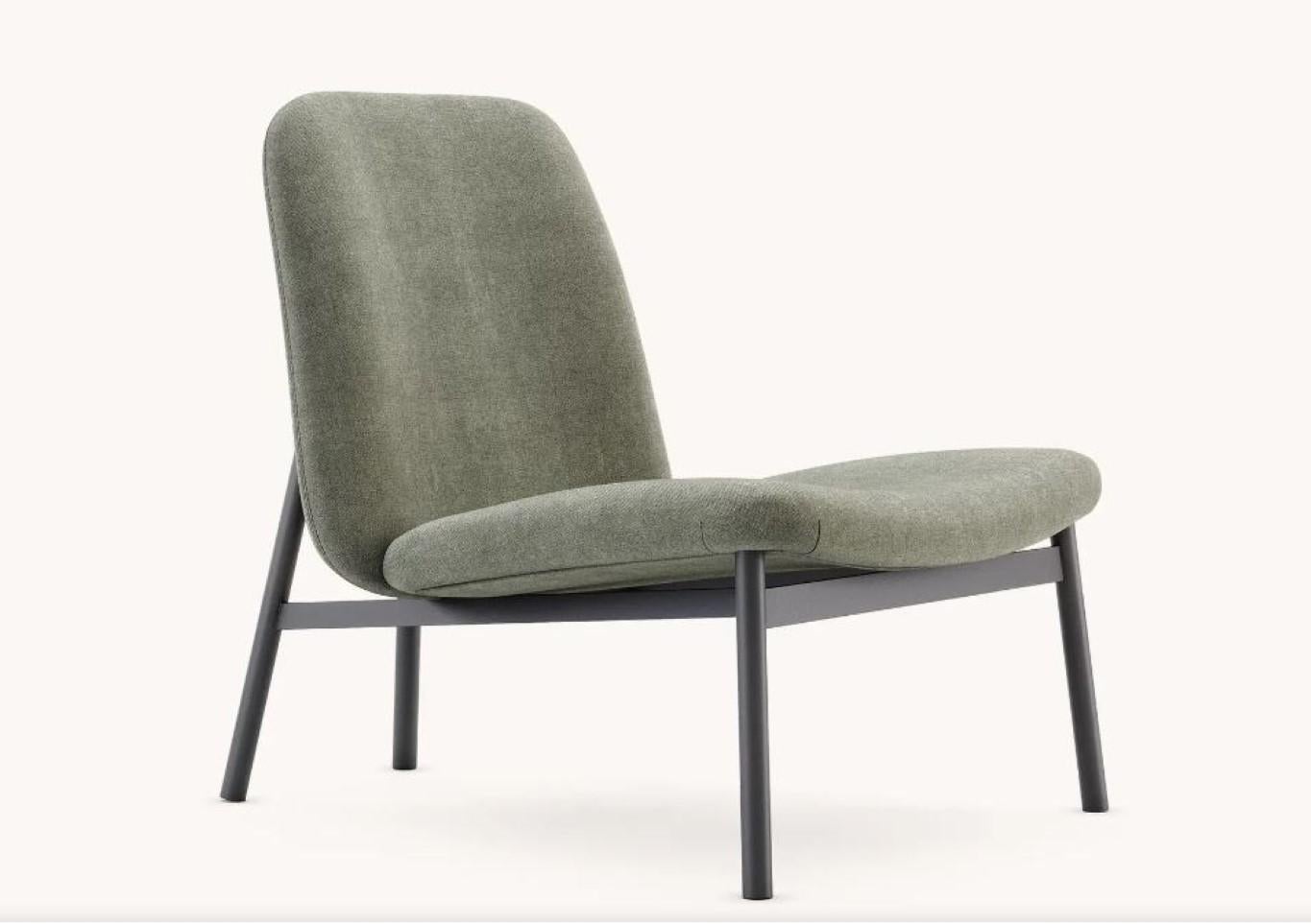 Edison armchair by Domkapa
Materials: Black Texturized Steel, Fabric. 
Dimensions: W 71 x D 88 x H 80 cm.
Also available in different materials. 

This armchair is the epitome of comfort and style combined. Both the back and the seat present a