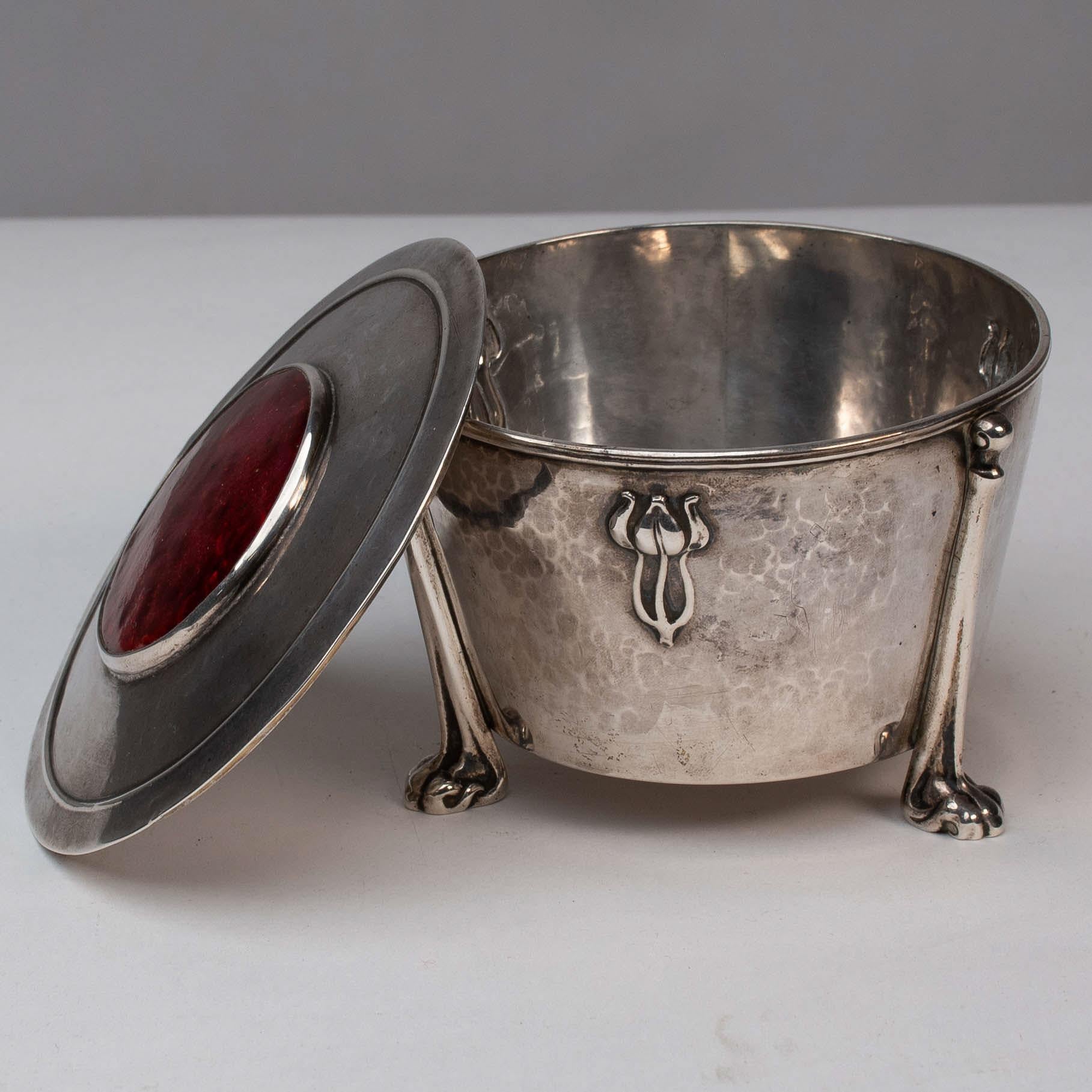 Edith Dawson. An Arts & Crafts Silver Pot with Floral Details & A Red Enamel Lid For Sale 1
