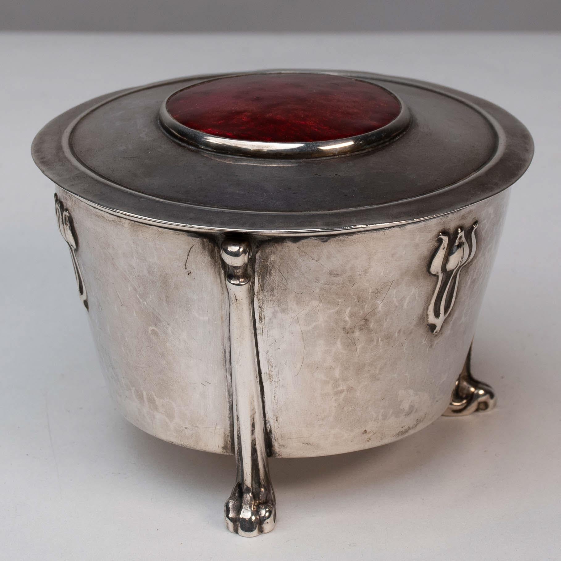 Arts and Crafts Edith Dawson. An Arts & Crafts Silver Pot with Floral Details & A Red Enamel Lid For Sale