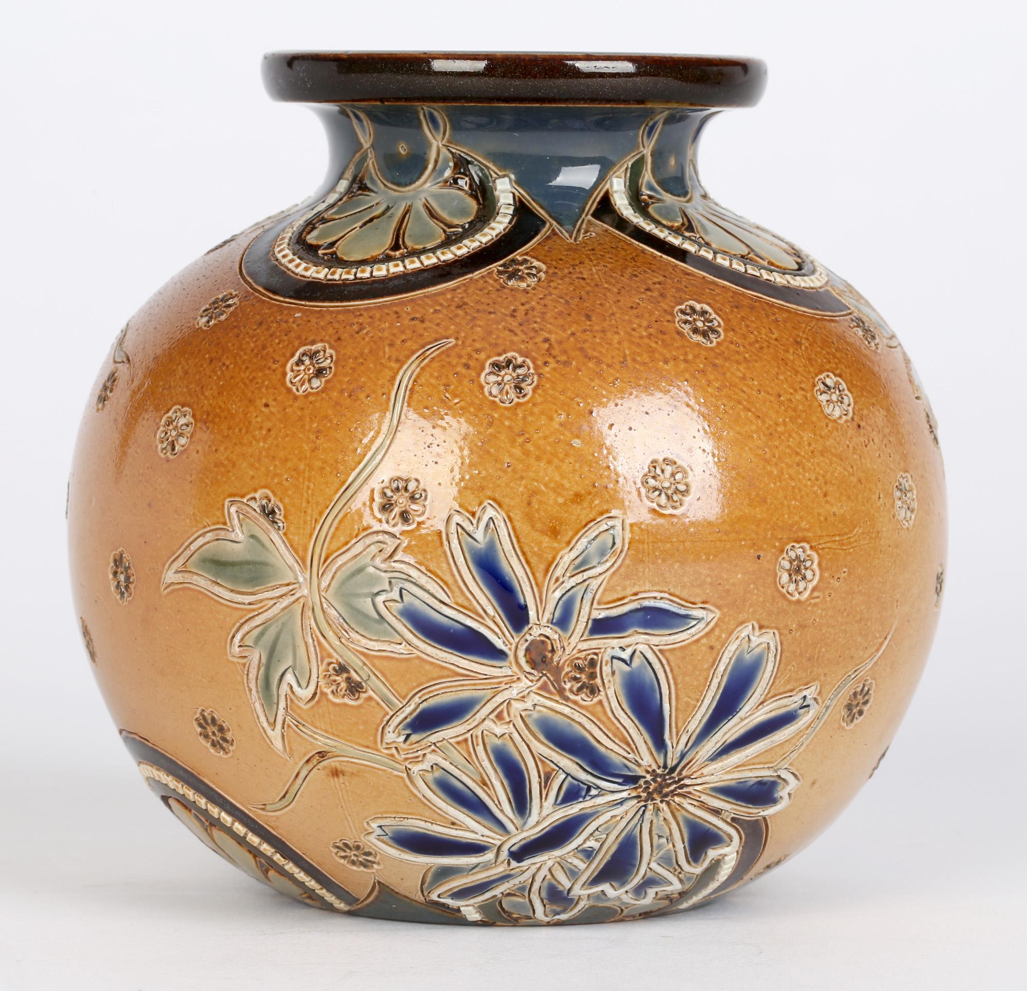 A fine Doulton Lambeth stoneware rounded vase decorated with incised stylized flower and foliage designs by Edith D Lupton, Mary Aitken, Alice Russel and Mary Davis dated between 1880 and 1891. This stylish stoneware vase stands on a narrow rounded