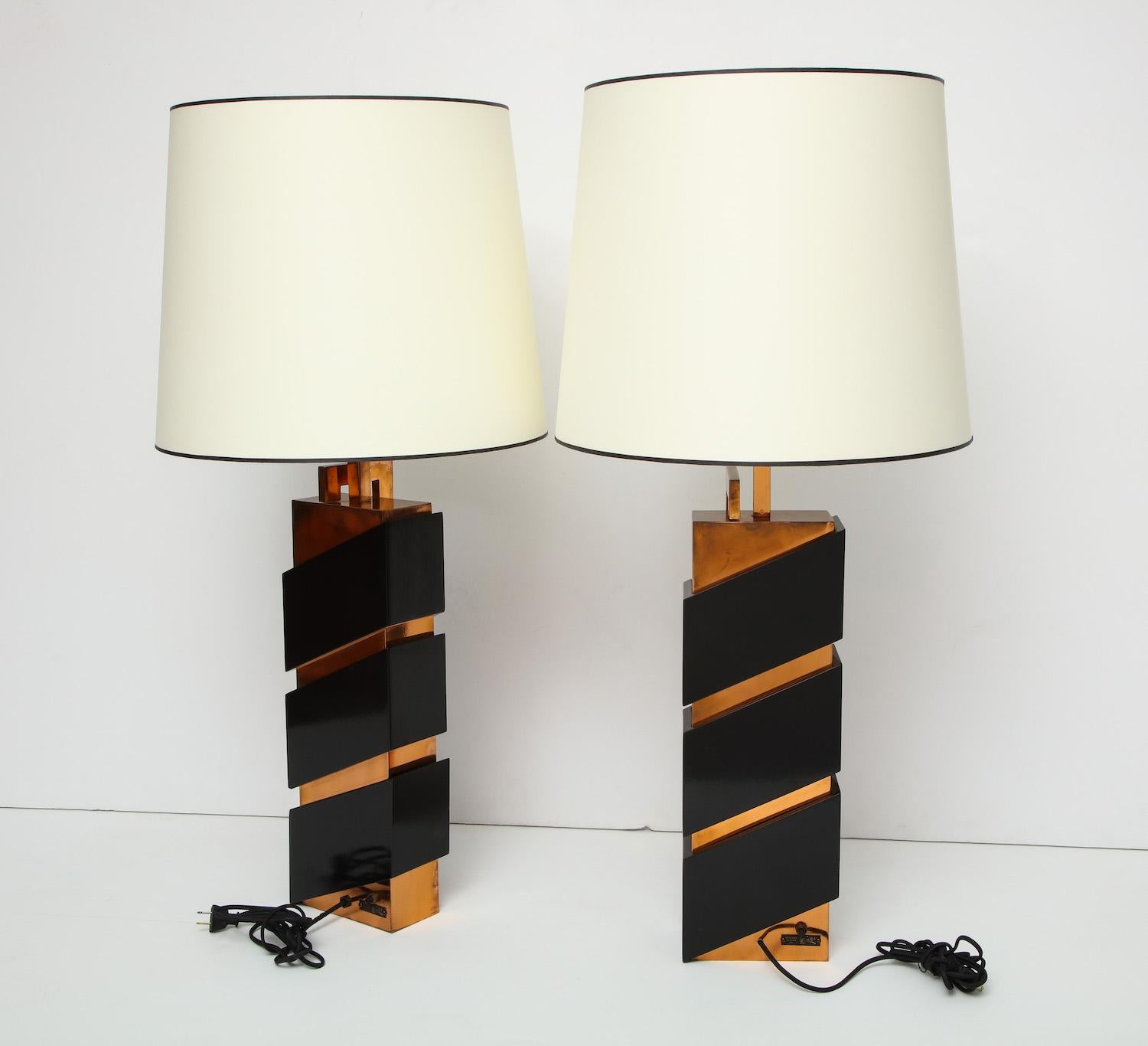 Unique pair of modernist table lamps by Edith Norton. Superb pair of custom table lamps by California modernist designer Edith Norton. Copper plated brass and black-painted wood with graphic forms and signed on rear. Each lamp has two standard