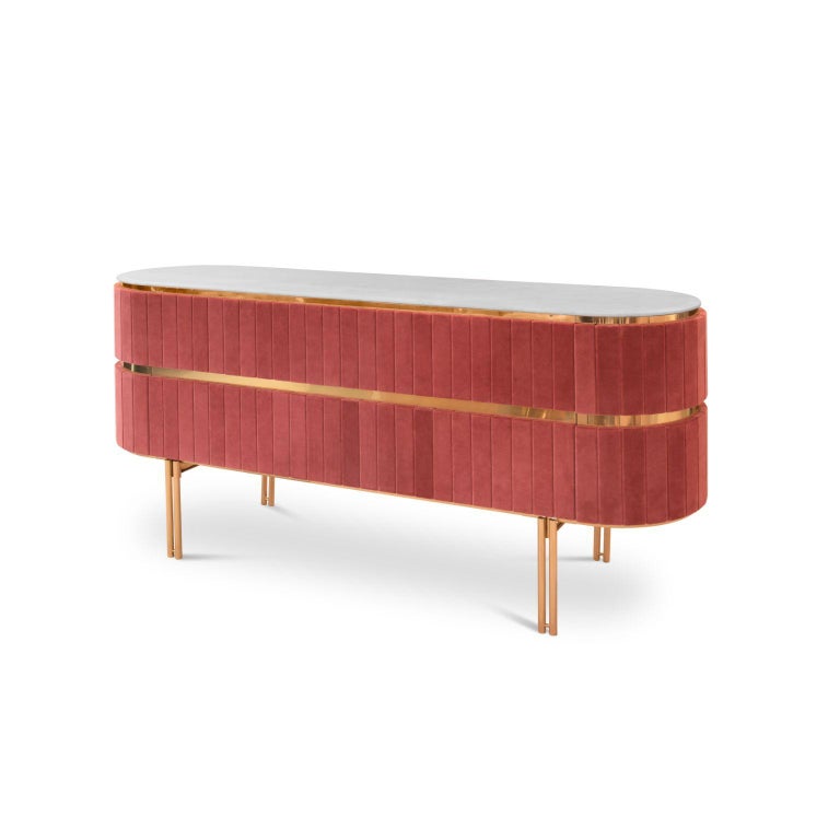 Mid-Century Modern Edith Sideboard in Pink with Brass Detail by Essential Home

Mid-Century Modern Edith Sideboard in Pink with Brass Detail are usually made out of wood. It is upholstered with a soft velvet, and stands out for its high-end look at