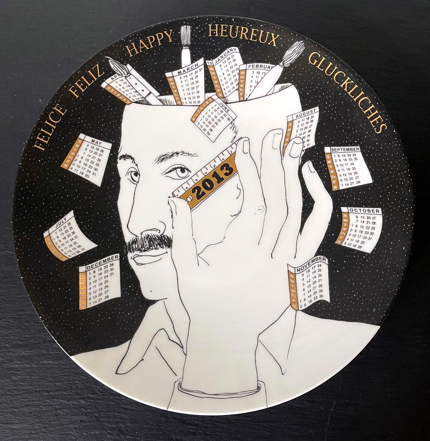 A vintage Italian decorative porcelain plate designed and made by Fornasetti. The commemorative plate is for the year of 2013. The plate was made in a limited edition of 92 out of 700. The back has the pre-drilled looping holes for wall display, and